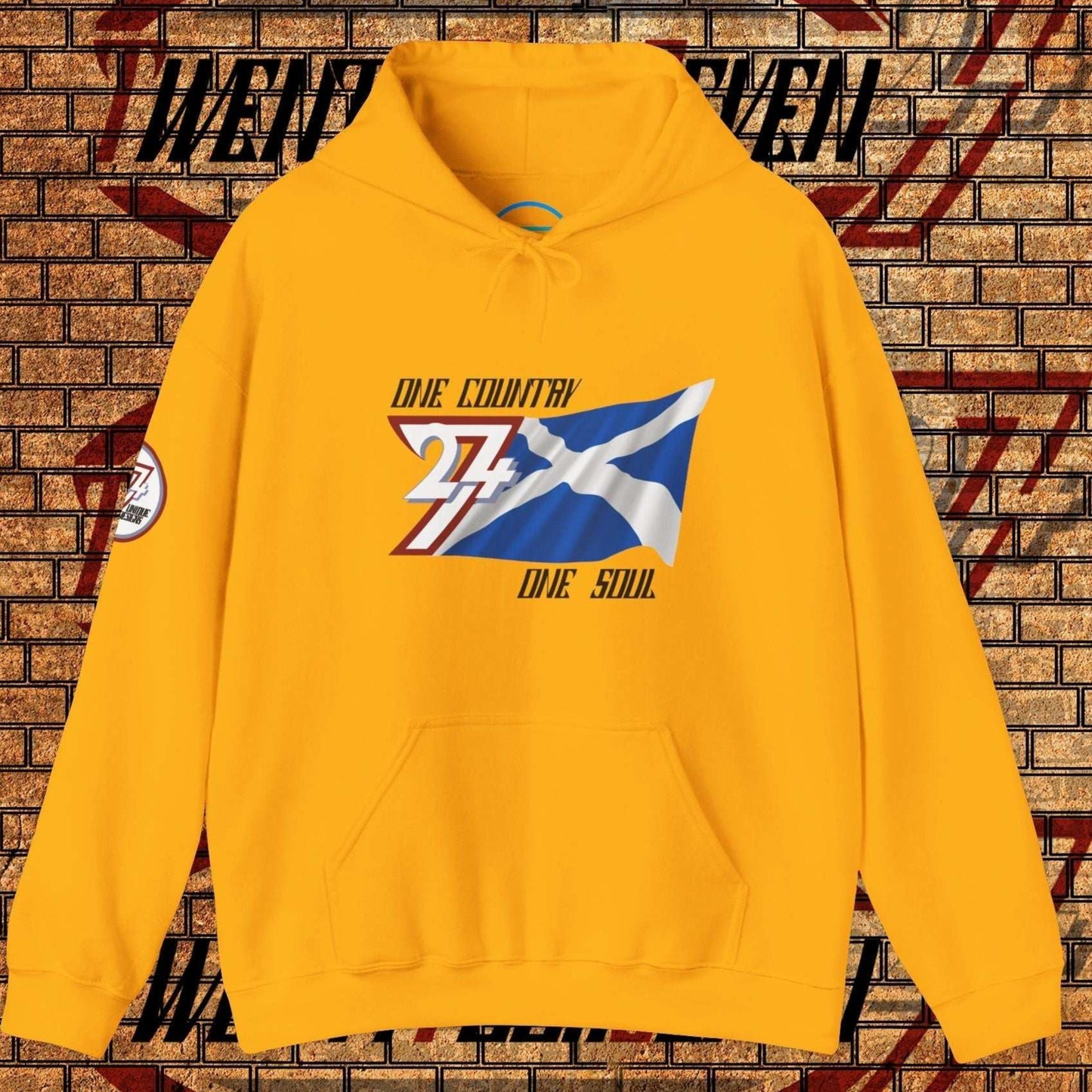 Front view of the Gold Alba flag hoodie featuring the refined artist-drawn design and motto.