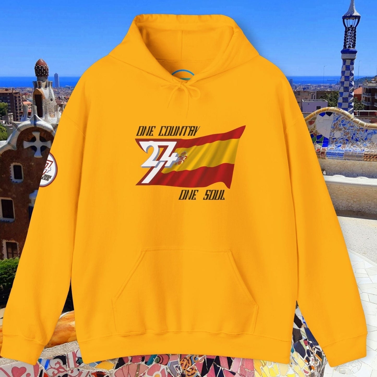 Front view of the Gold España flag hoodie featuring the refined artist-drawn design and motto.