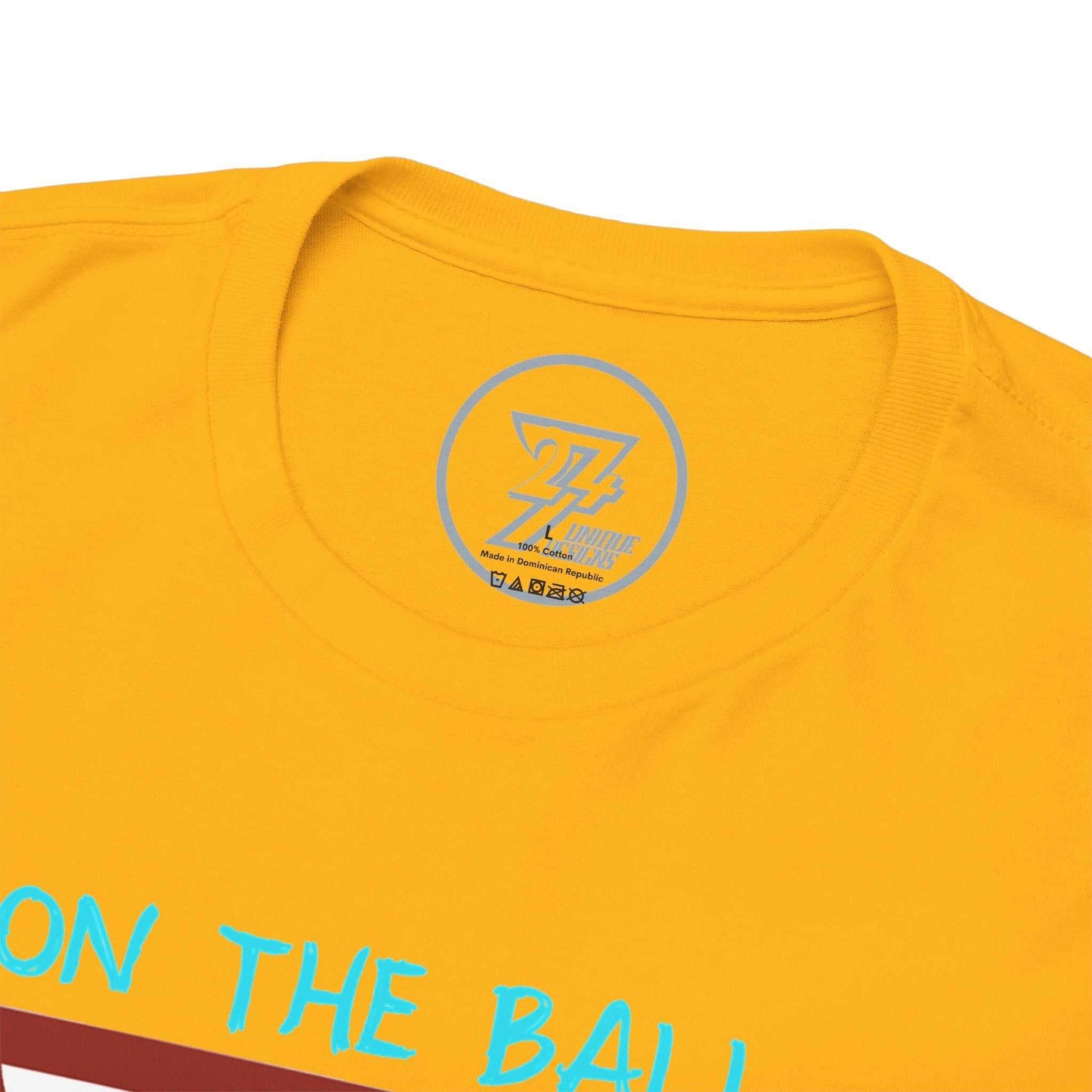 Close-up of the ribbed knit collar on the gold vintage sports t-shirt, clearly showing the official 24/7 Unique Designs trademark logo inner label branding.