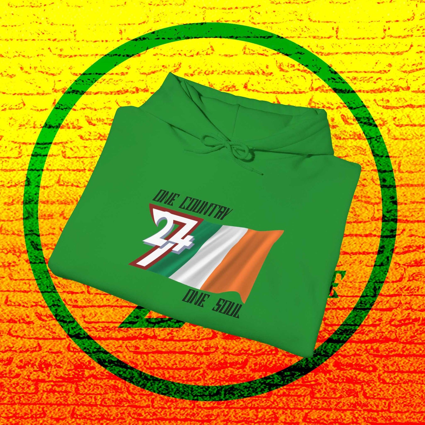 A professional display of the Éire flag hoodie in Irish Green, folded to showcase the refined hand-drawn graphic and 8oz fabric weight.