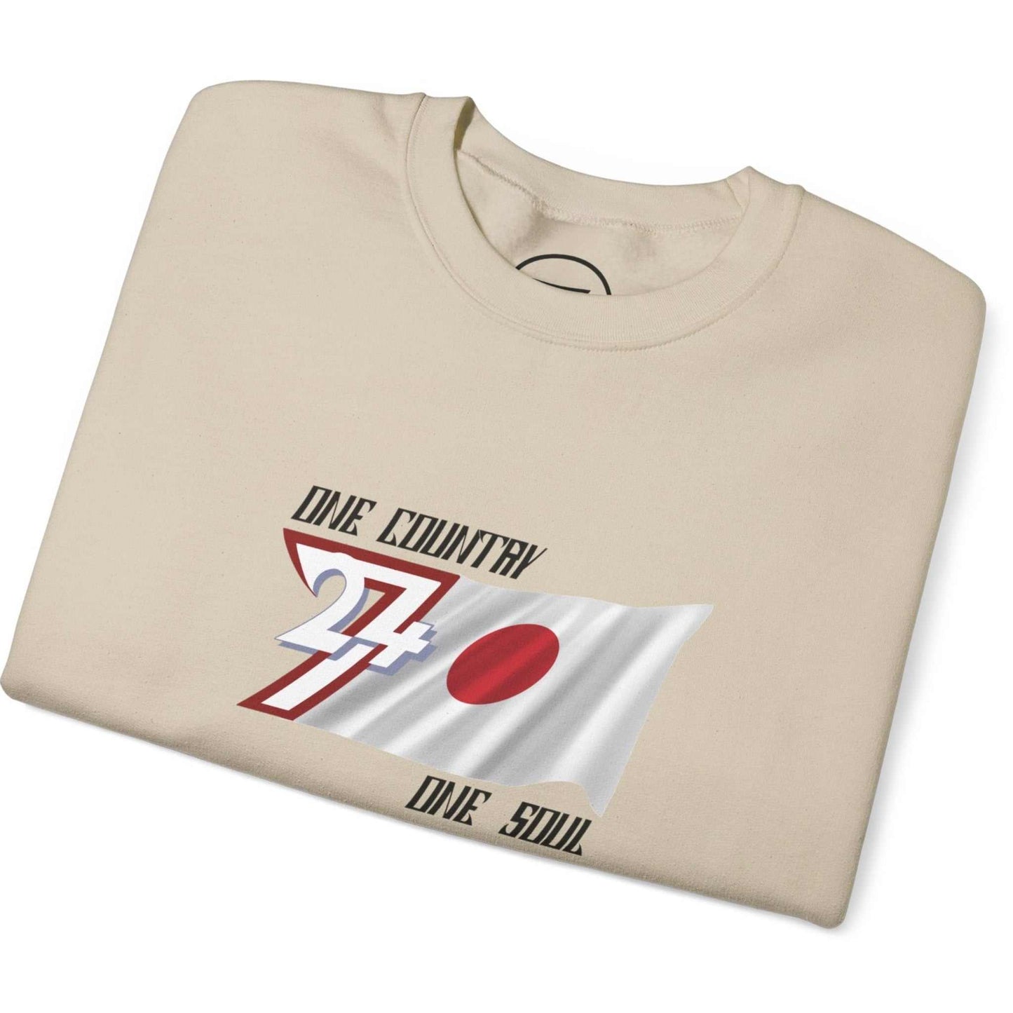 Folded beige Japan flag sweatshirt with graphic design on a white background