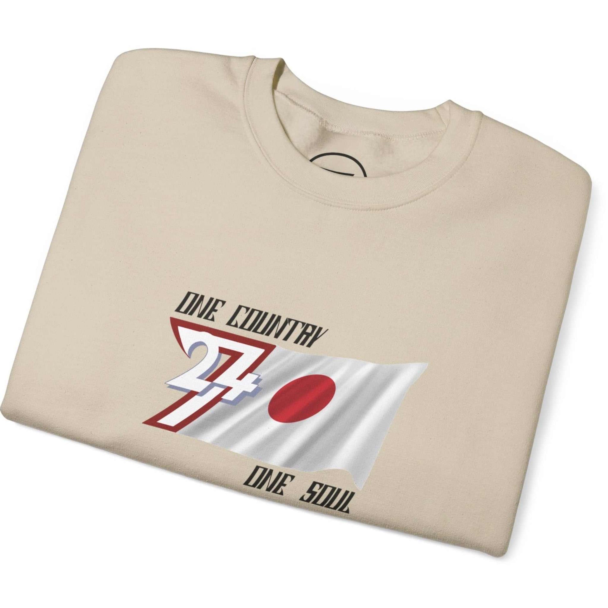 Folded beige Japan flag sweatshirt with graphic design on a white background