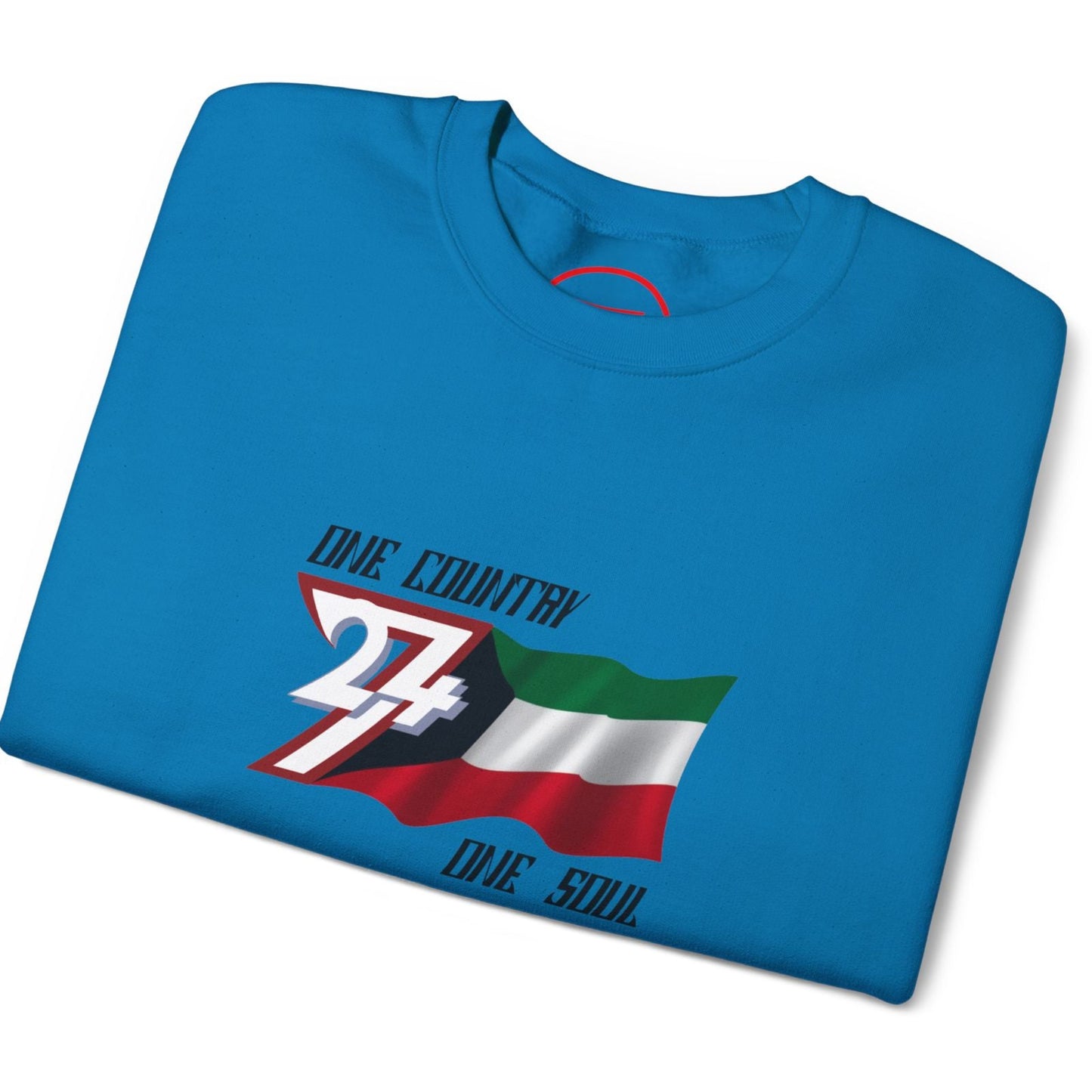 Folded tropical blue t-shirt with Kuwait flag design on a white background
