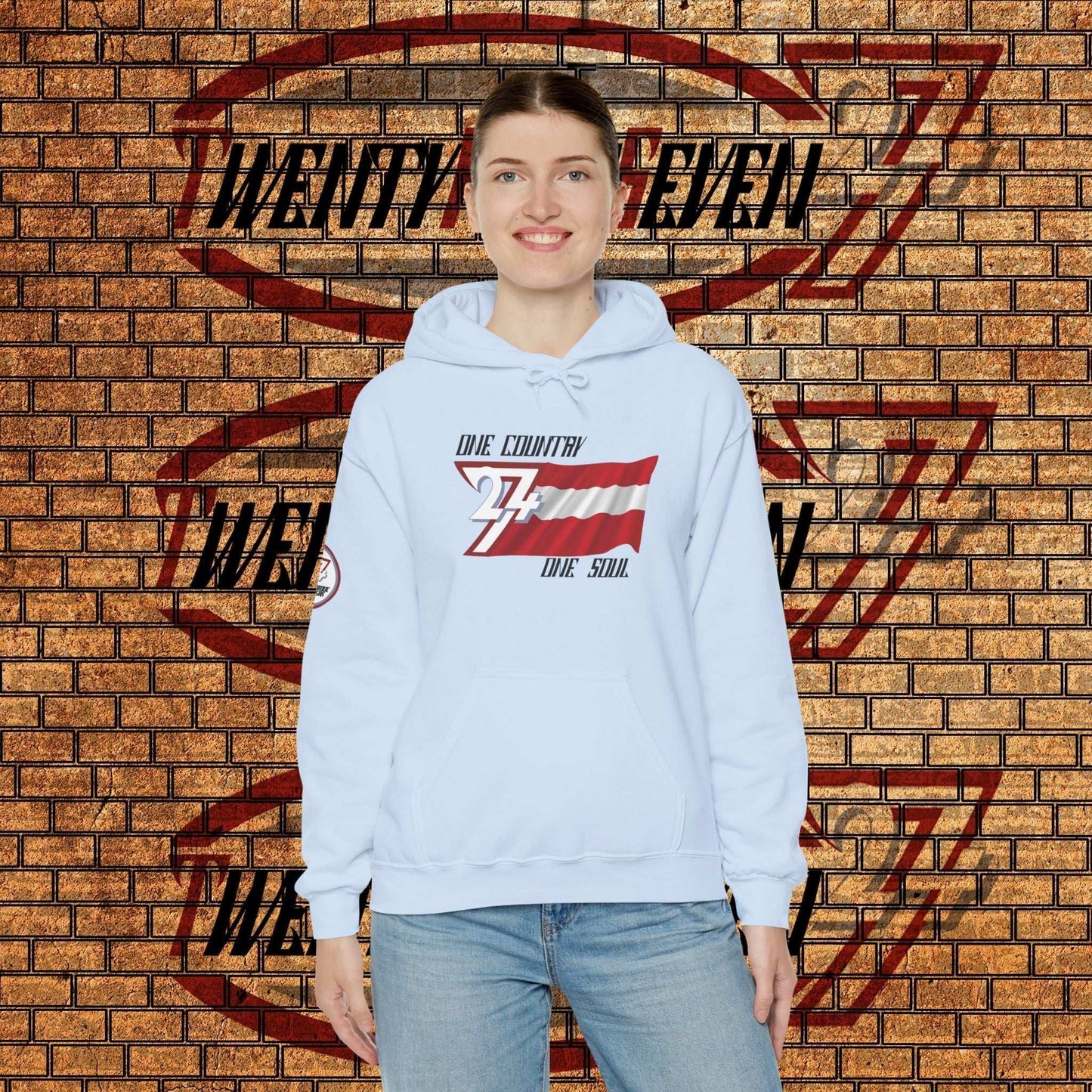 Model wearing the Österreich "Alpine" hoodie in Light Blue, styled for a modern streetwear look.