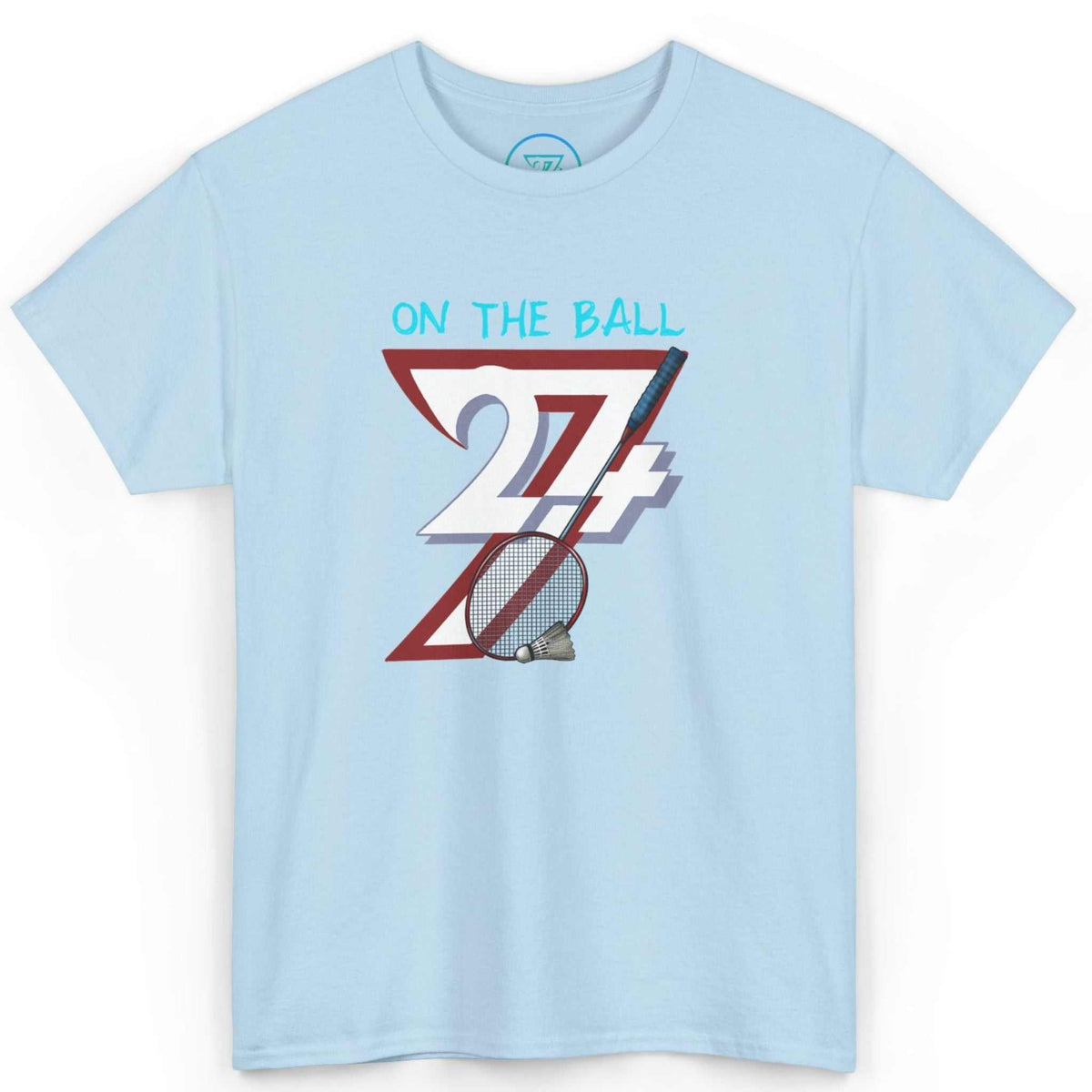 Front view of a light blue comic-style badminton graphic tee featuring the digitally hand-drawn On the Ball art, displayed on a clean background.