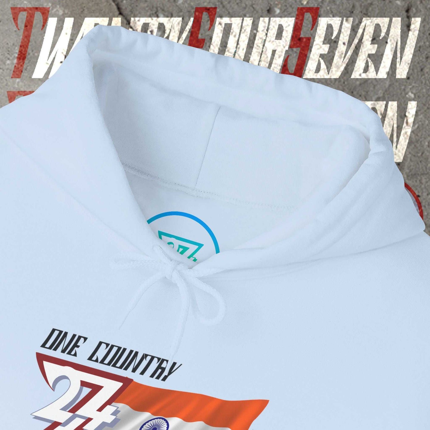 Macro close-up of the inner neck area showing the tear-away label and authentic 24/7 Unique Designs trademark logo.