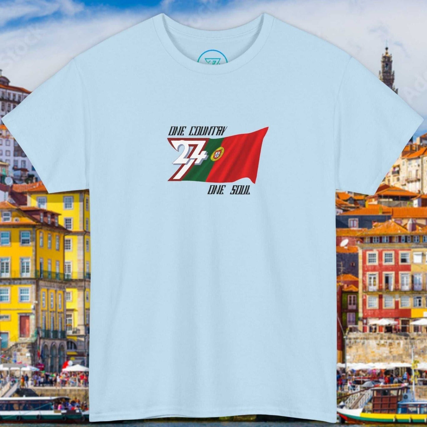 Front view of a light blue graphic t-shirt featuring a digitally hand-drawn Portugal flag design.