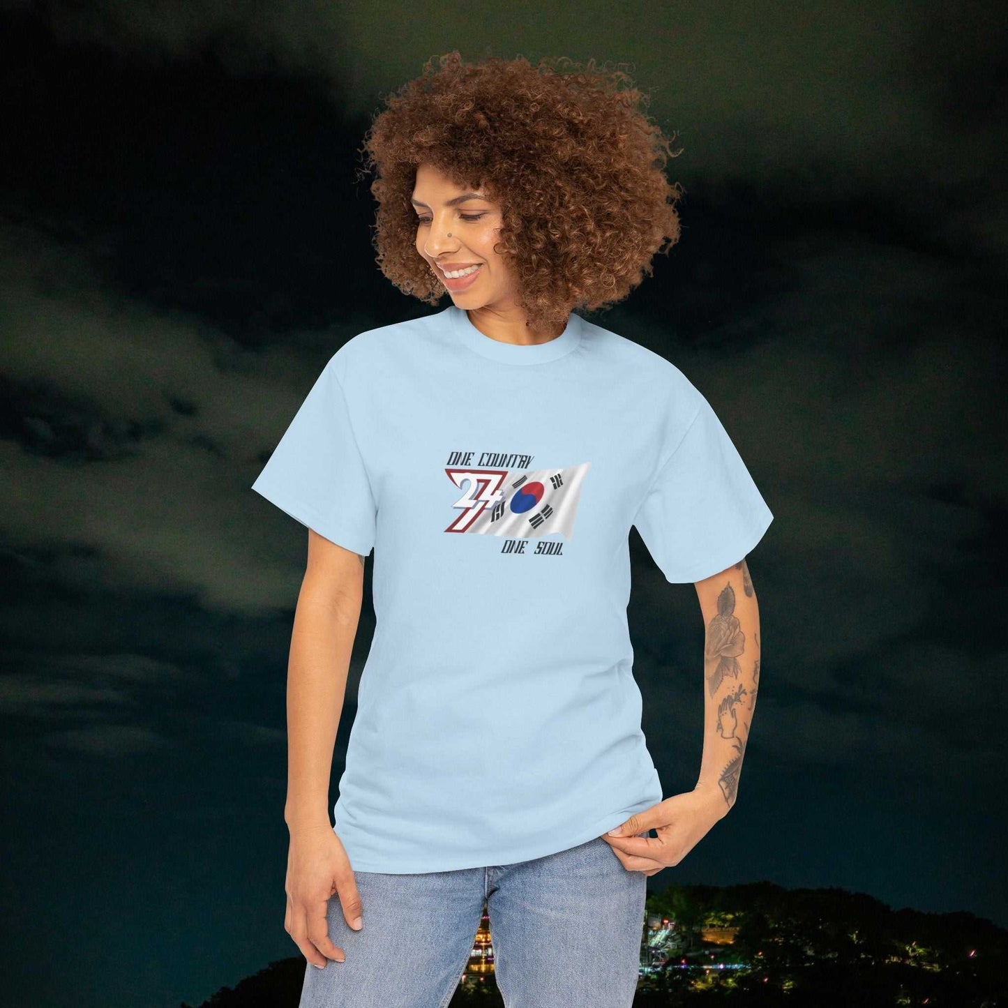 Young woman wearing light blue South Korea Flag Graphic Tee with hand-drawn Taegeukgi design in casual streetwear style