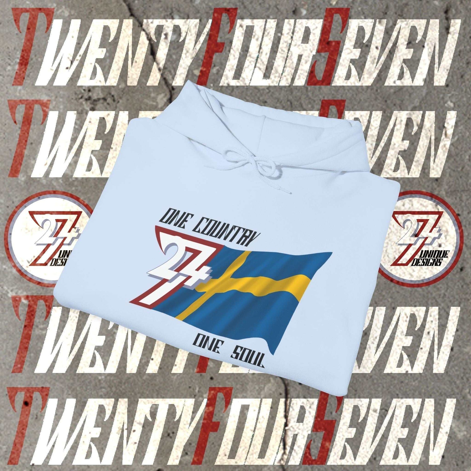 A professional display of the Sverige flag hoodie in Light Blue, folded to showcase the refined hand-drawn graphic and 8oz fabric weight.