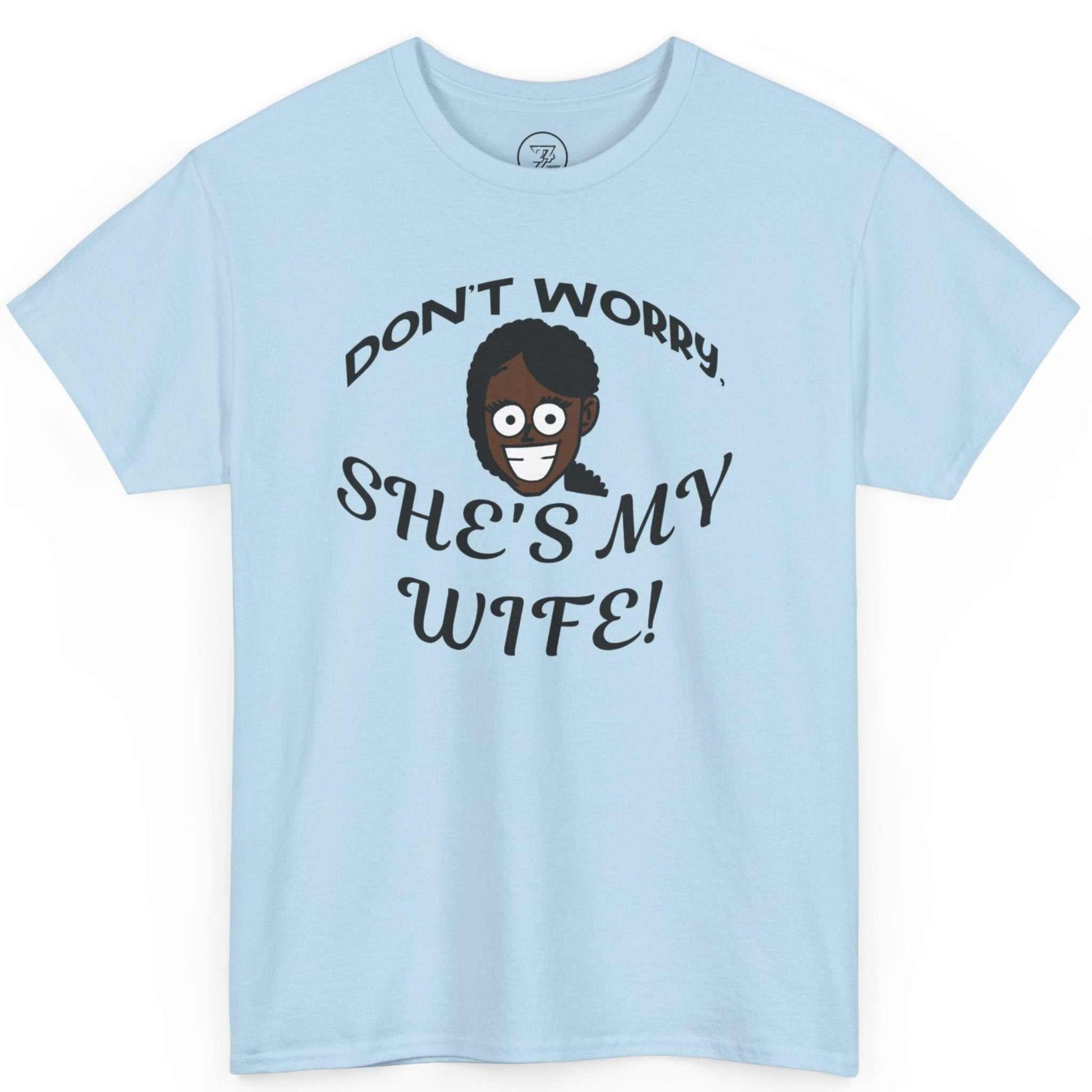 Solid light blue viral meme festival tee displaying the don't worry she's my wife typography.