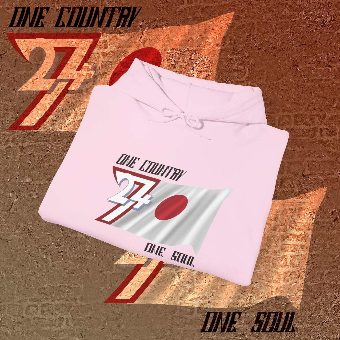 A professional display of the Nihon flag hoodie in Light Pink, folded to showcase the refined hand-drawn graphic and 8oz fabric weight.
