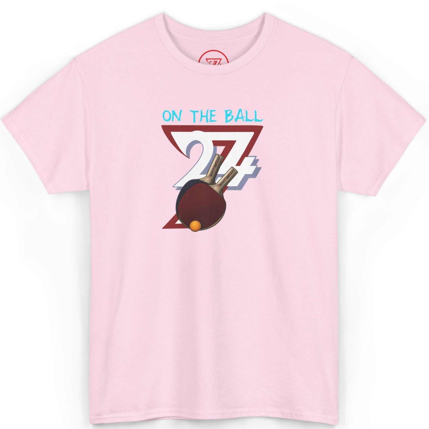 Front view of a light pink table tennis club apparel tee highlighting the energetic hand-drawn art, laid flat on a clean background.