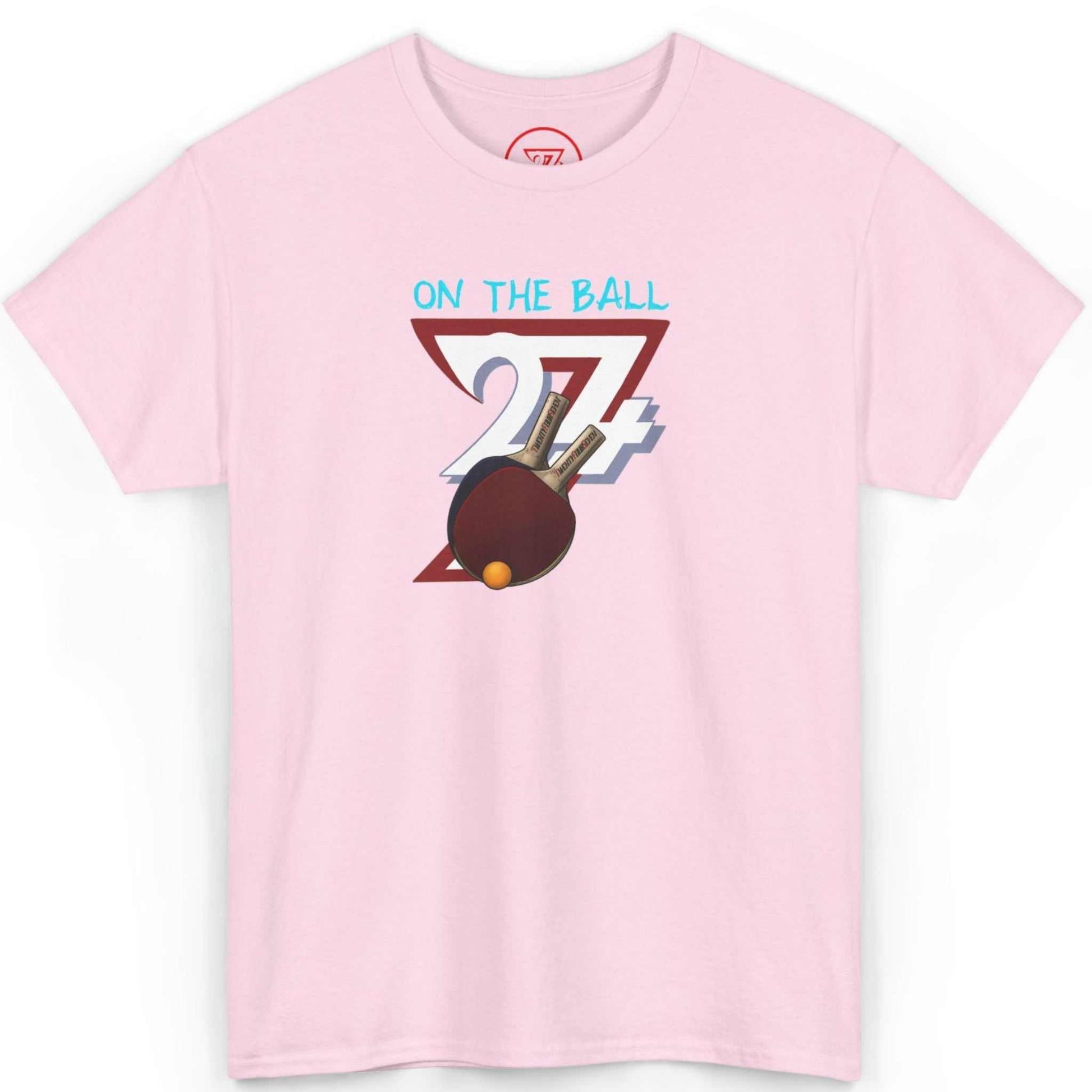 Front view of a light pink table tennis club apparel tee highlighting the energetic hand-drawn art, laid flat on a clean background.