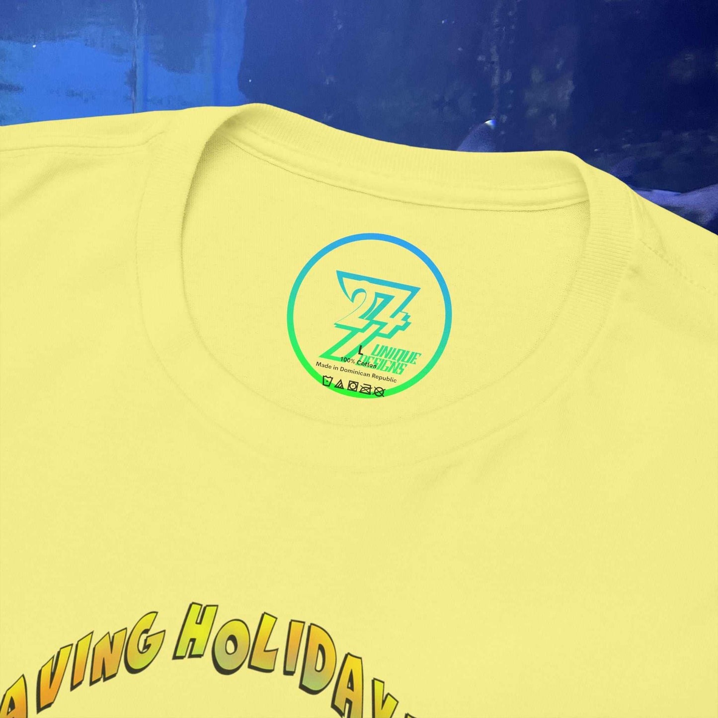 Close-up of a light yellow t-shirt collar showing a neat crew neckline and high-quality cotton fabric.