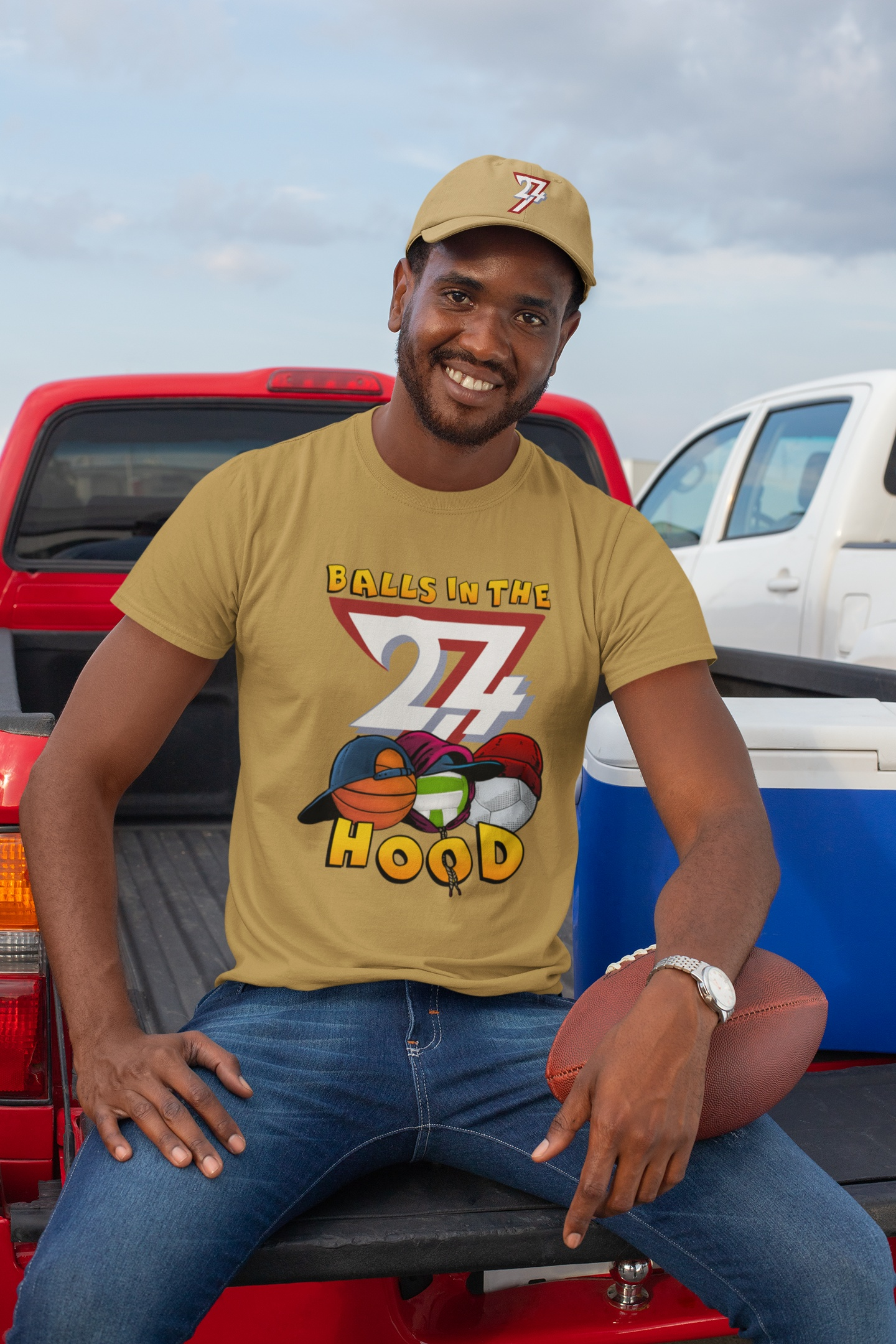 Male model casually styling the retro streetwear tee with the sports illustration.