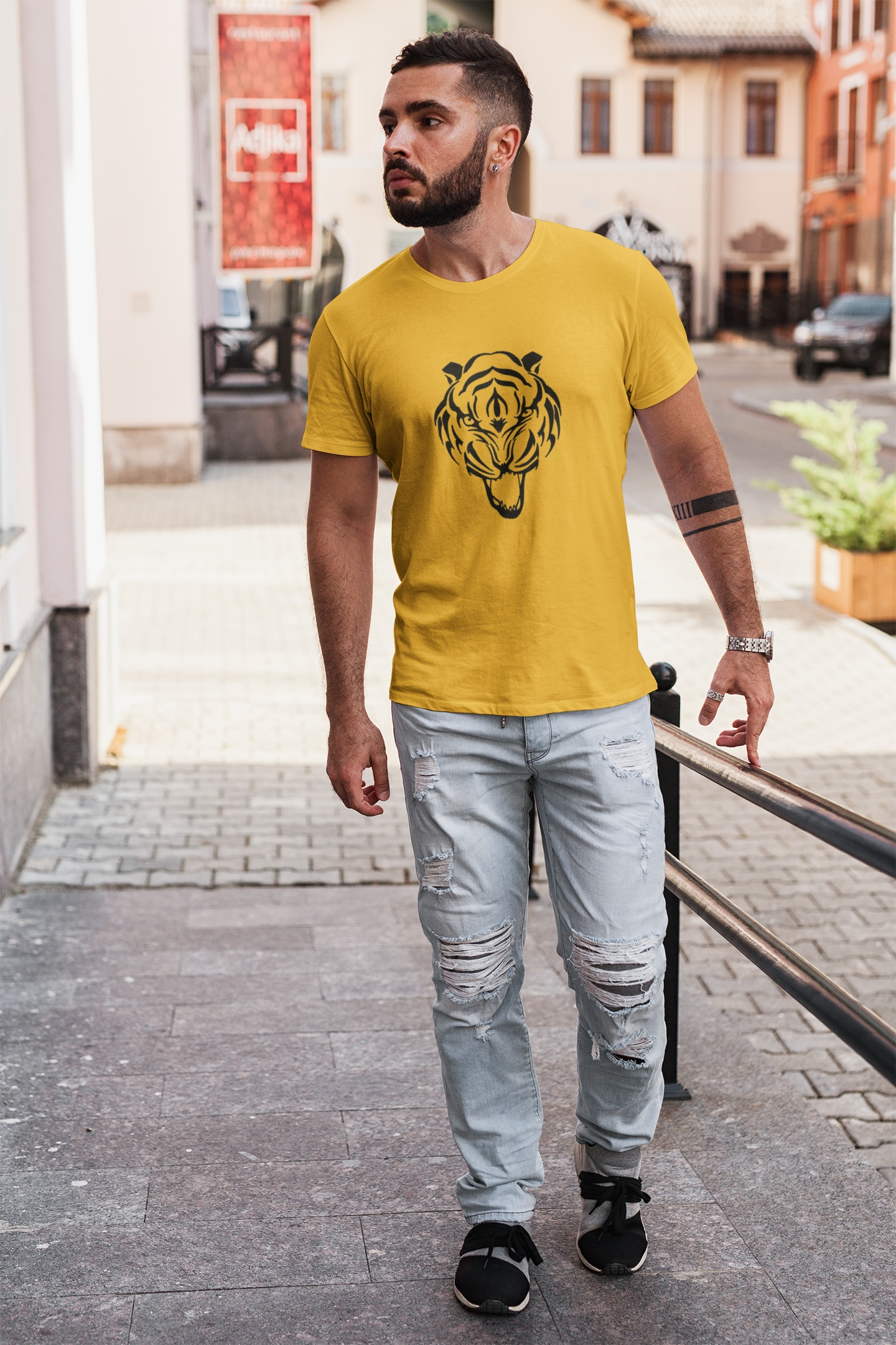 Male model wearing the fierce tiger head graphic tee, demonstrating the classic unisex athletic fit.