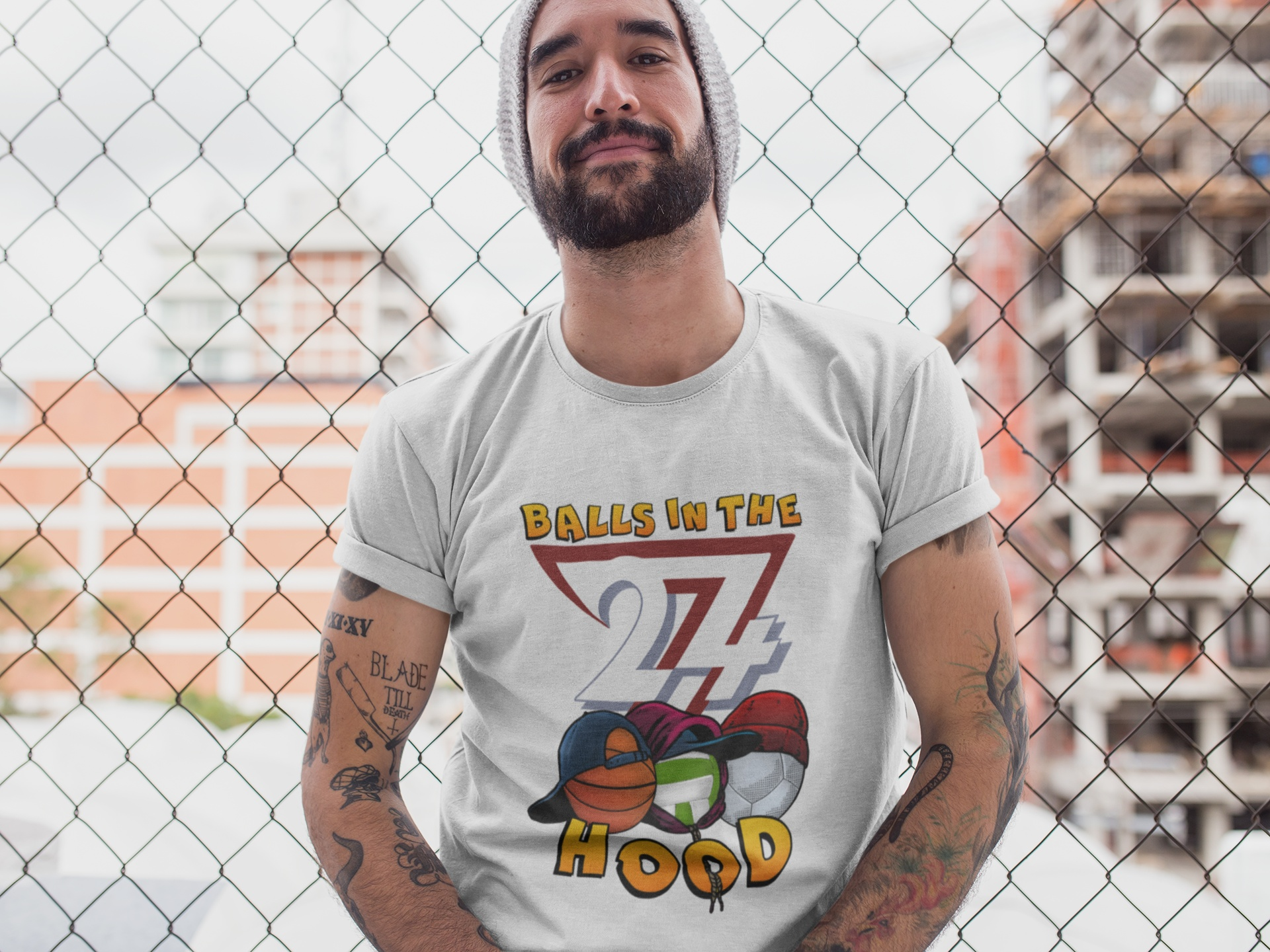Front view of a male model wearing the Balls in the Hood graphic t-shirt by 24/7 Unique Designs.