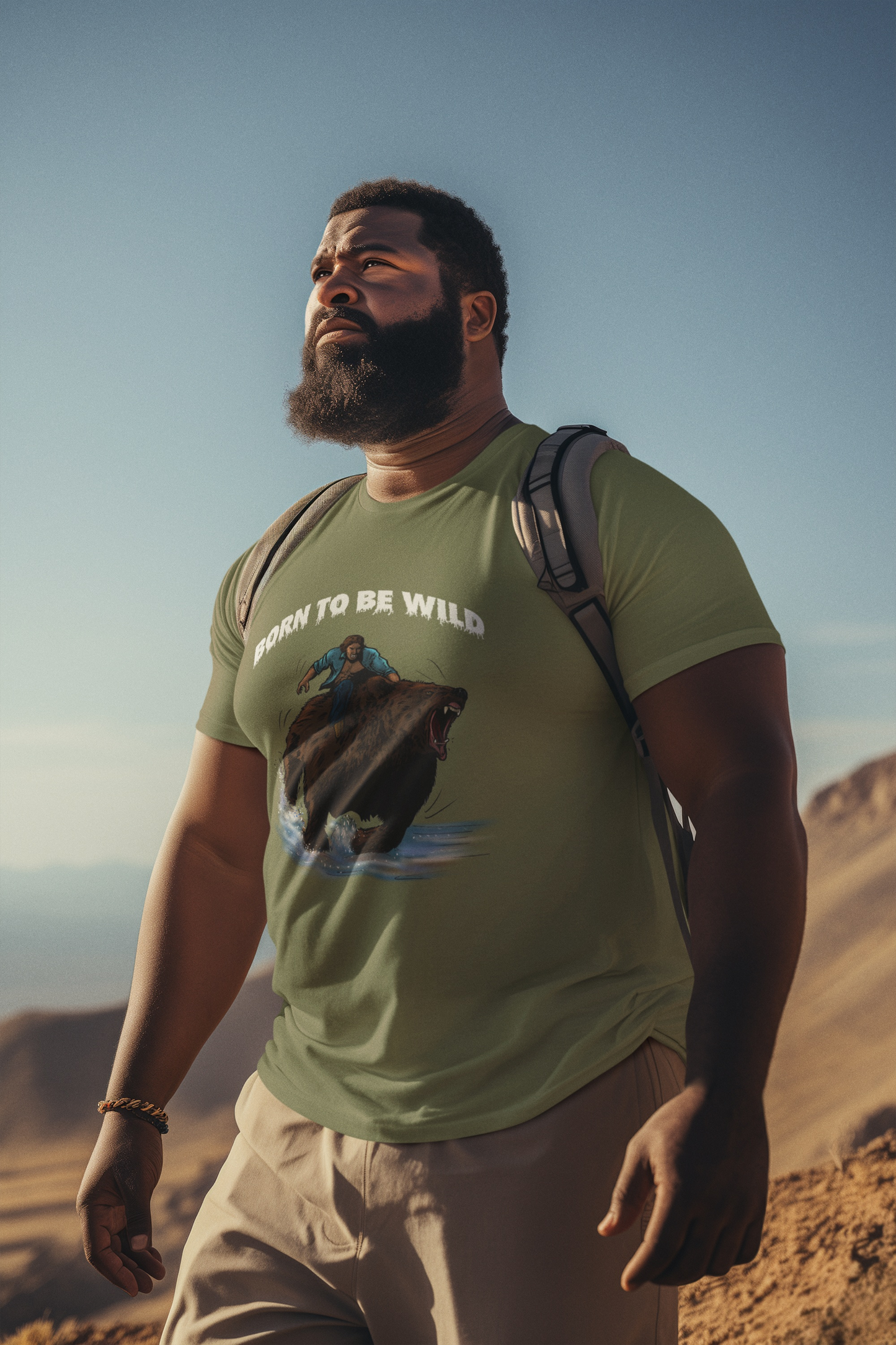 Male model wearing the military green Born to Be Wild bear graphic tee, demonstrating the casual unisex fit.