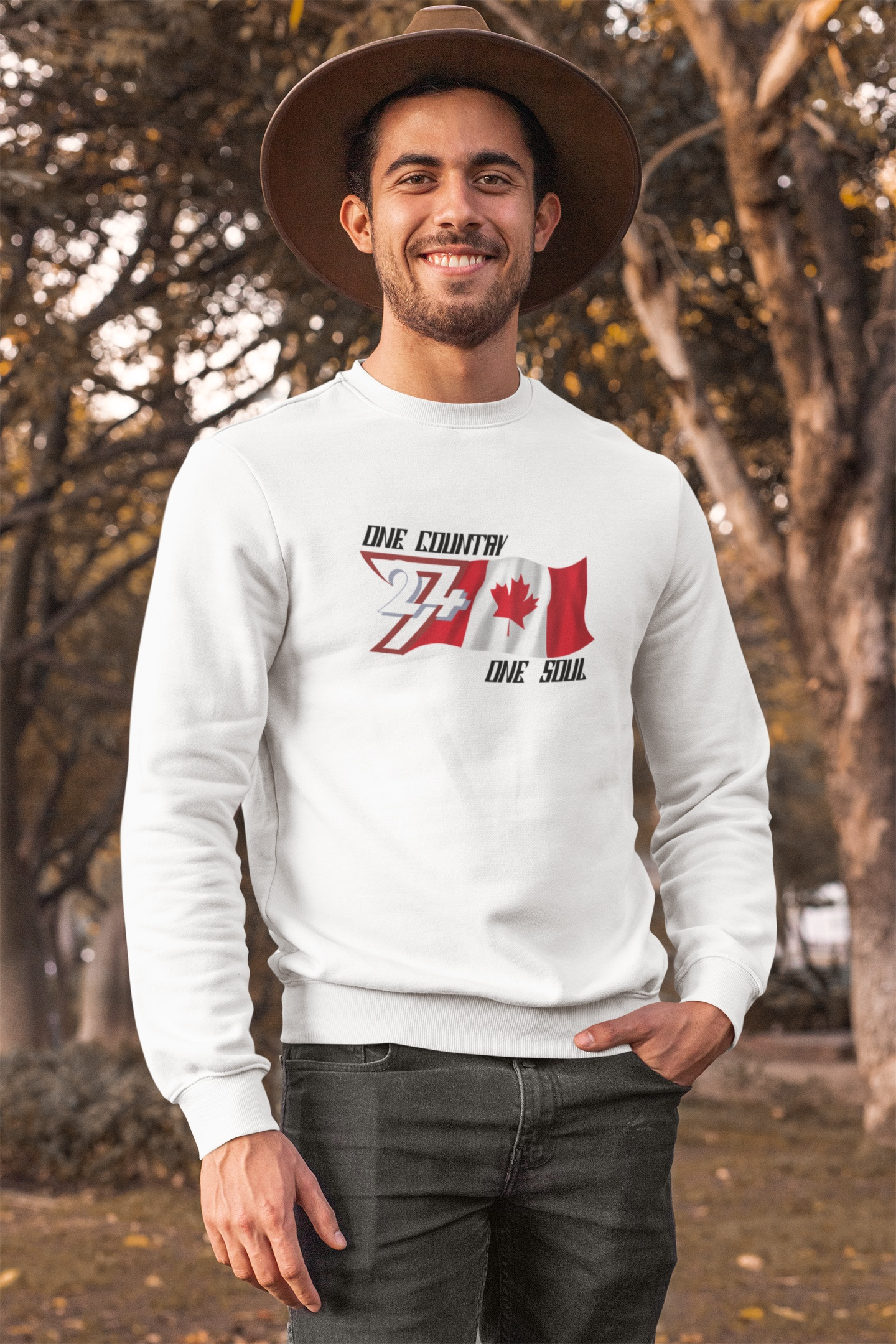 Front view of a male model wearing the white Canada flag graphic sweatshirt, demonstrating the cozy winter fit.
