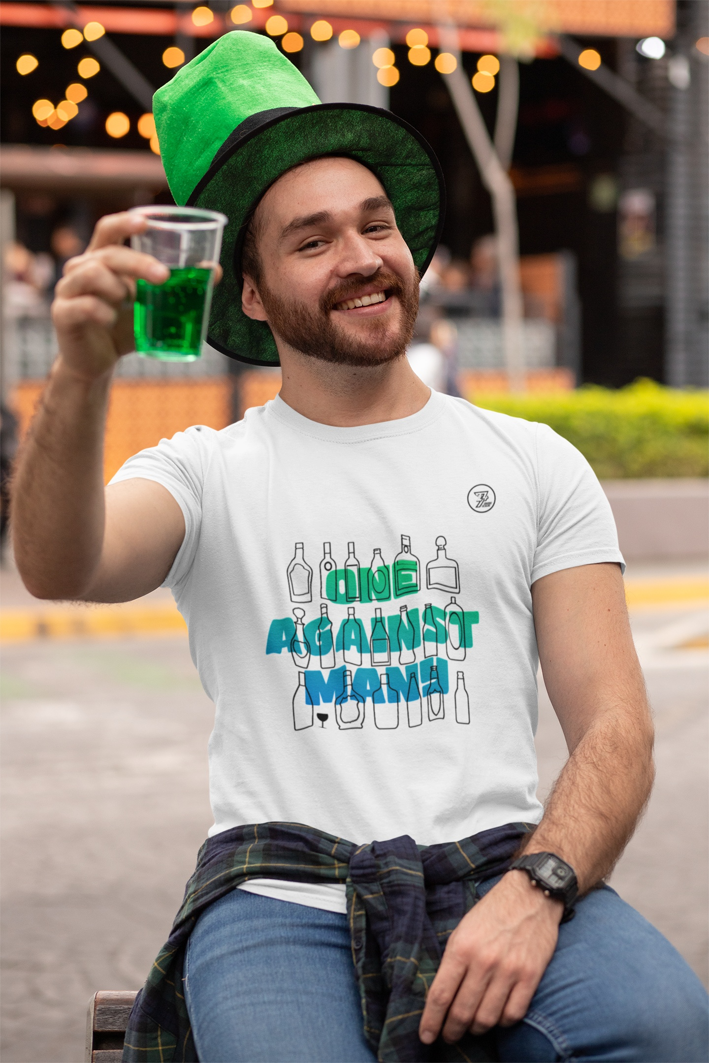 Male model wearing the white introvert graphic tee to showcase the unisex fit, standing outdoors in a casual summer party setting.