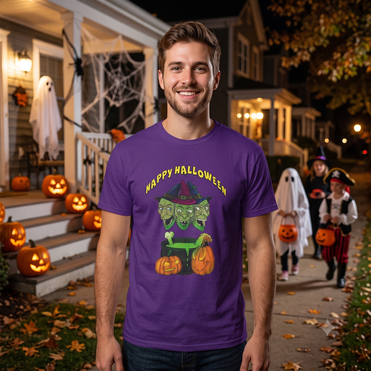 Smiling man standing on a neighborhood sidewalk at twilight, wearing the vibrant purple trick or treat t-shirt while costumed children walk in the background.