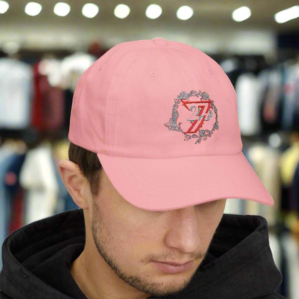 Front view of a man styling the pink casual elegant floral hat with a basic t-shirt.