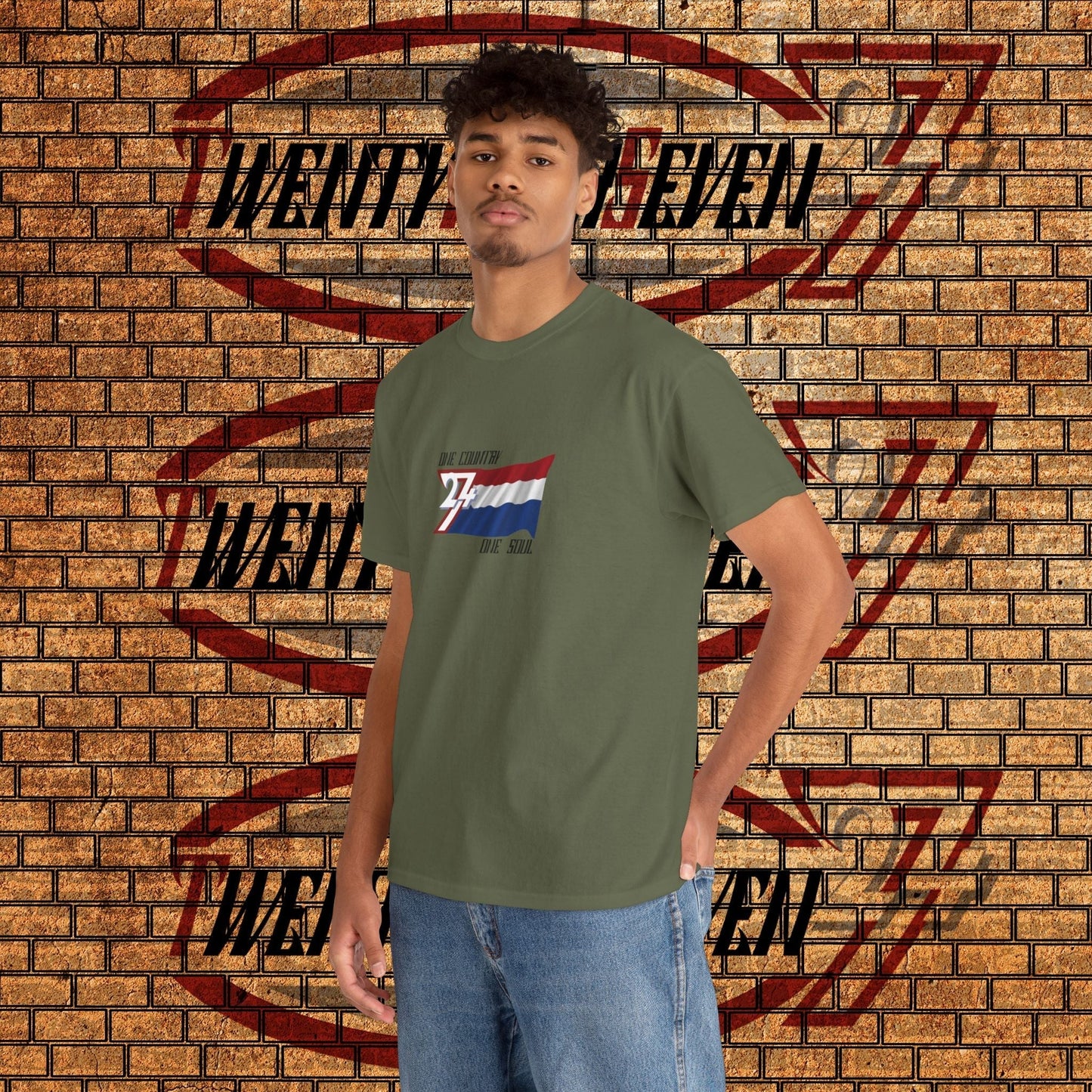 Male model wearing the hand-drawn Netherlands flag t-shirt in military green, perfect for Oranje fans.