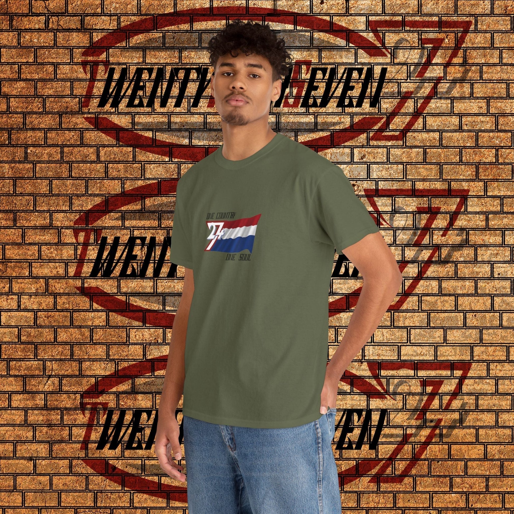 Male model wearing the hand-drawn Netherlands flag t-shirt in military green, perfect for Oranje fans.