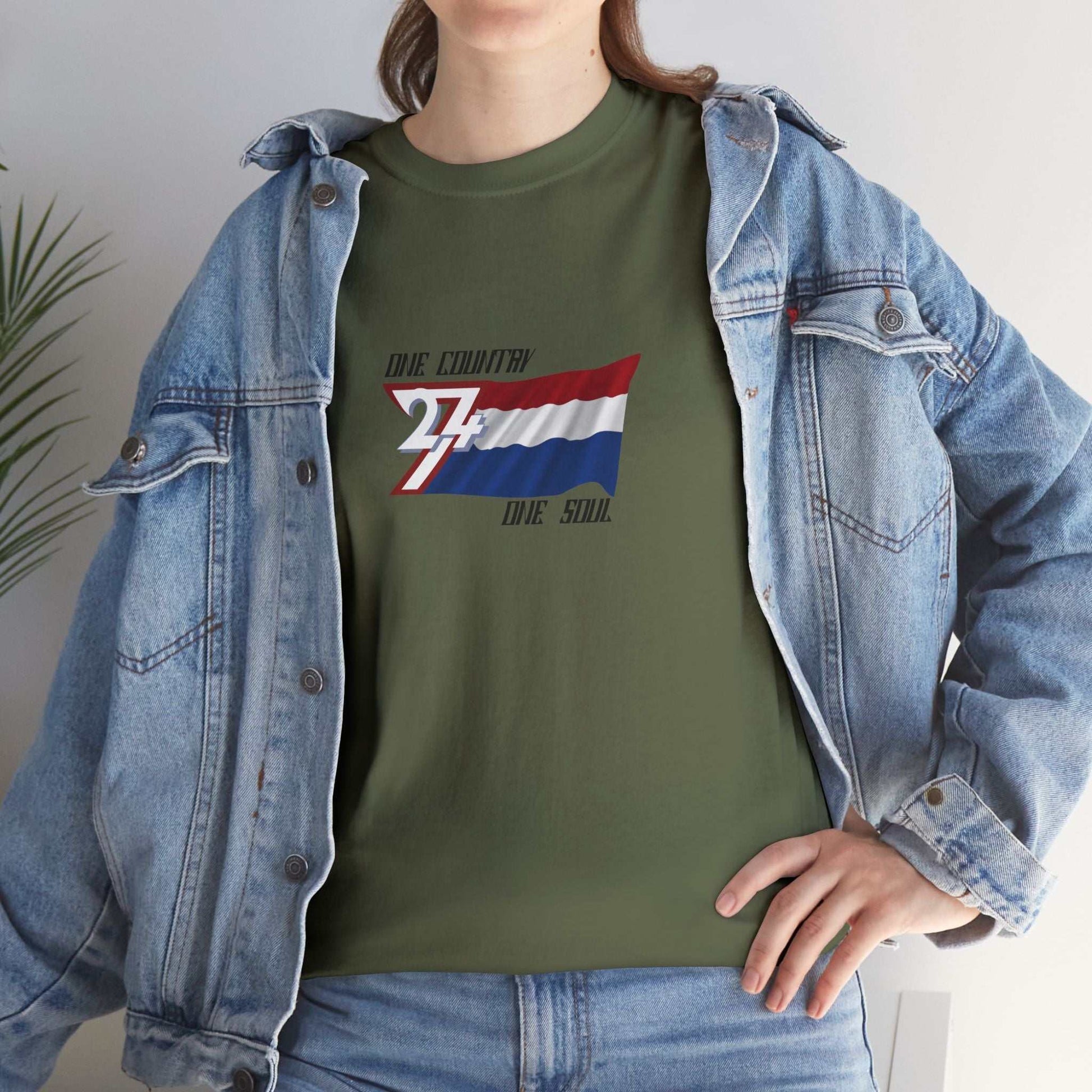 Person wearing a green Netherlands graphic t-shirt with a unique design Norway flag and a denim jacket.