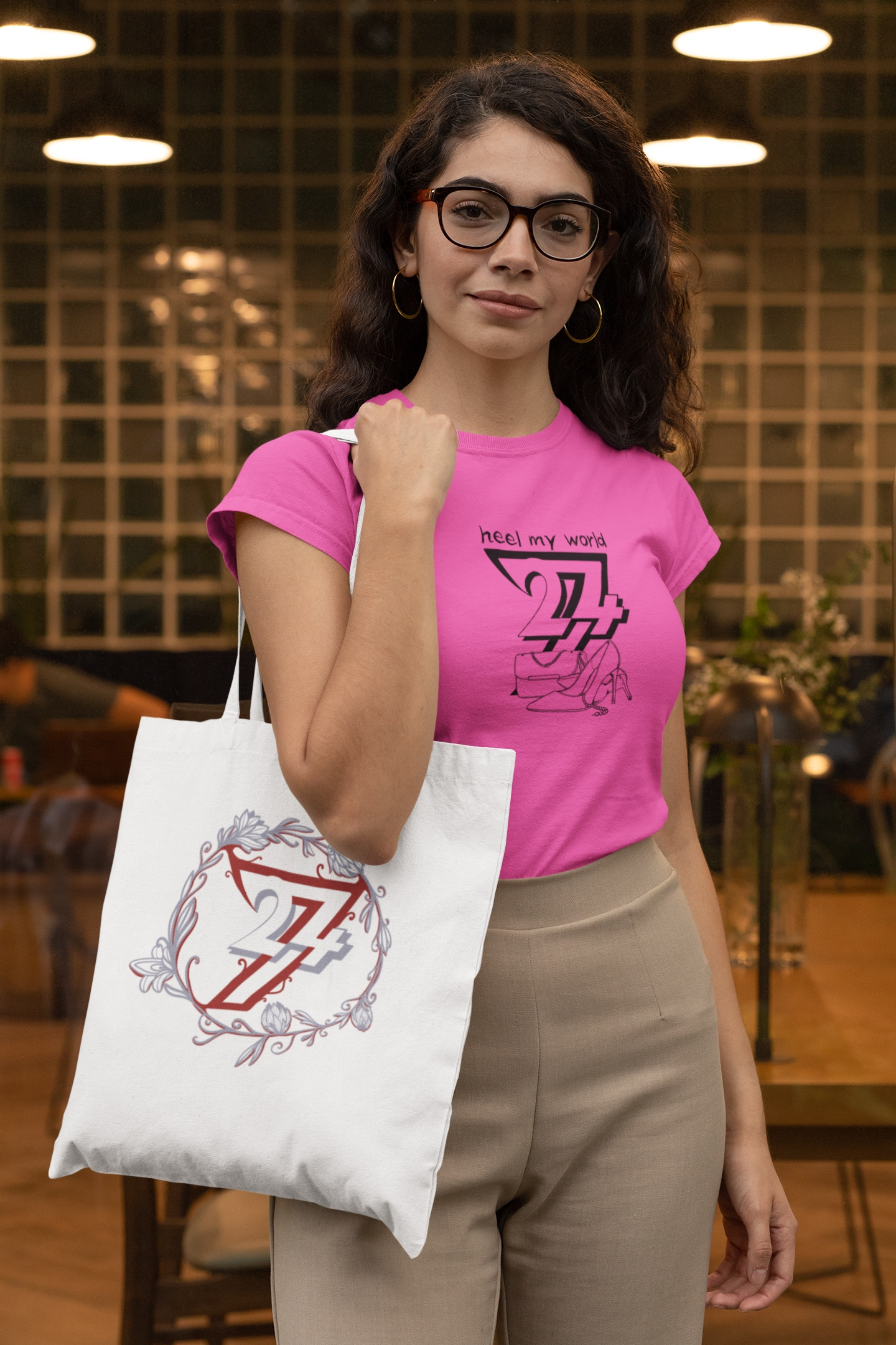 A female model wearing the vibrant azalea pink distinctive fashion silhouette t-shirt in a stylish lifestyle setting.