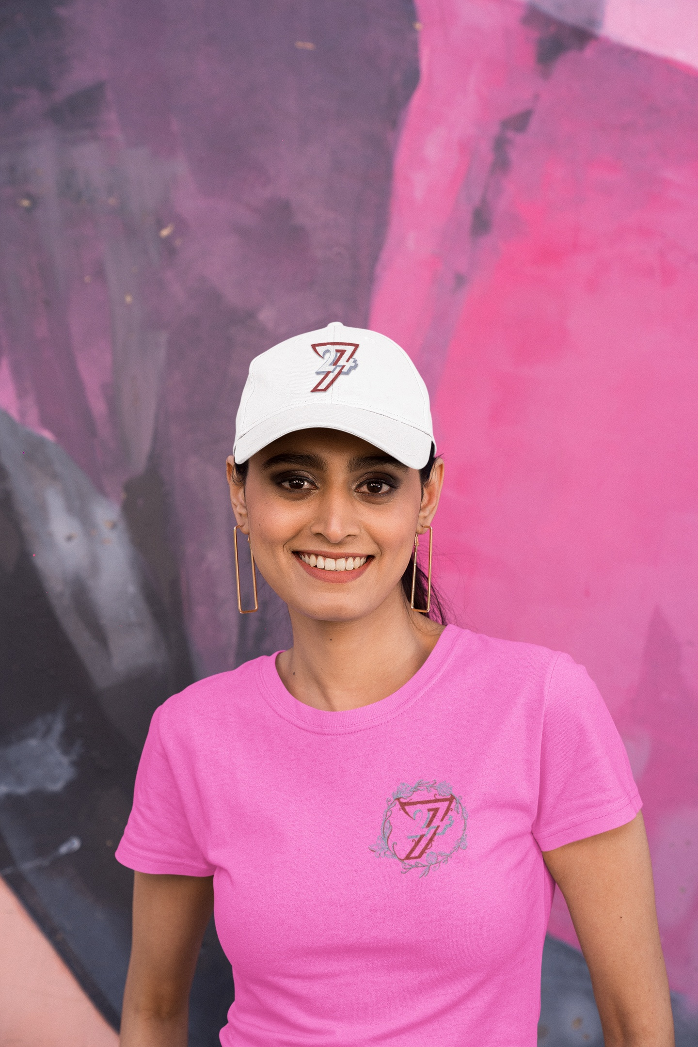 Female model wearing the Azalea women's floral wreath graphic tee and 24/7 baseball hat