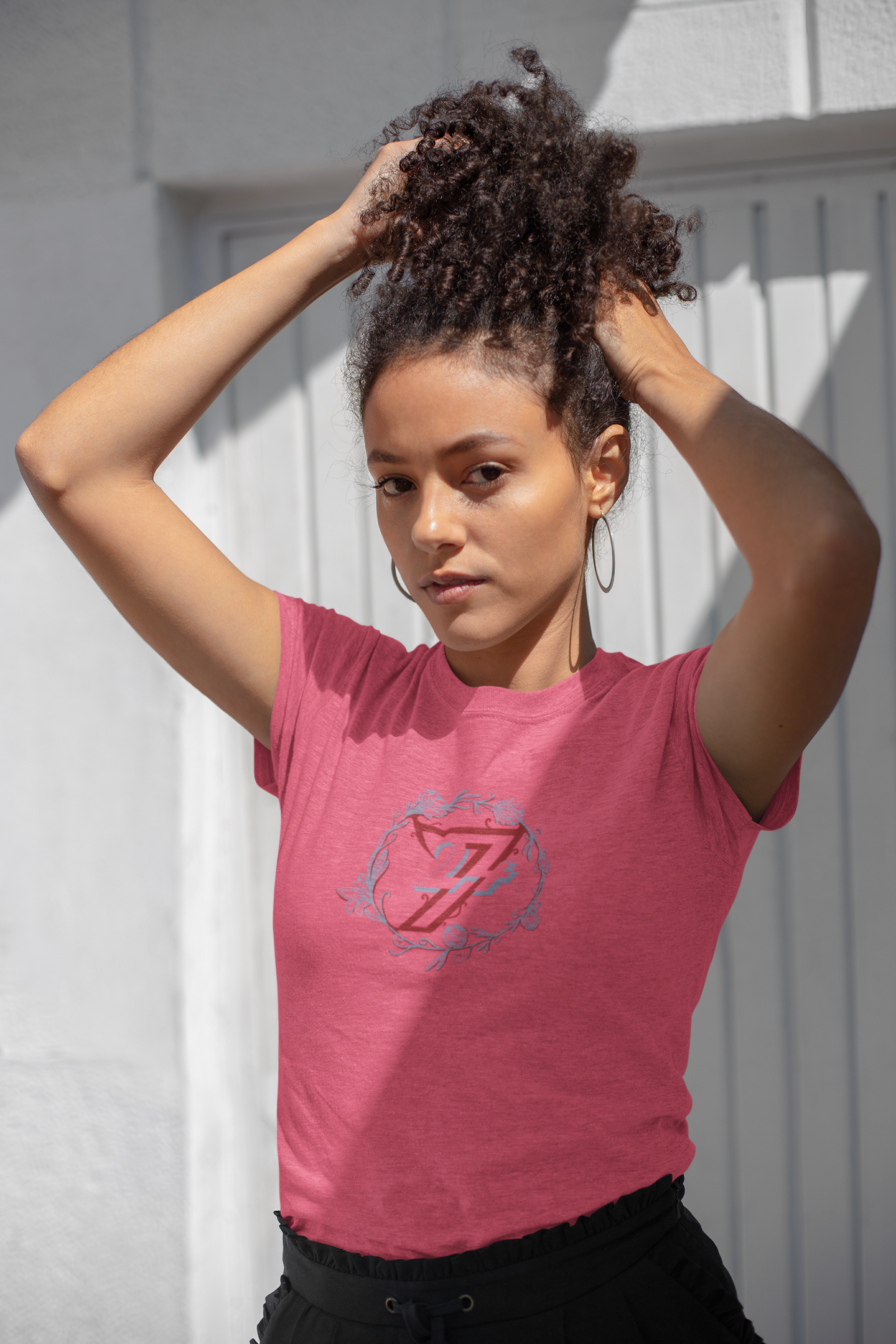 Woman in a vibrant azalea pink Mother's Day gift shirt with an exclusive nature graphic.