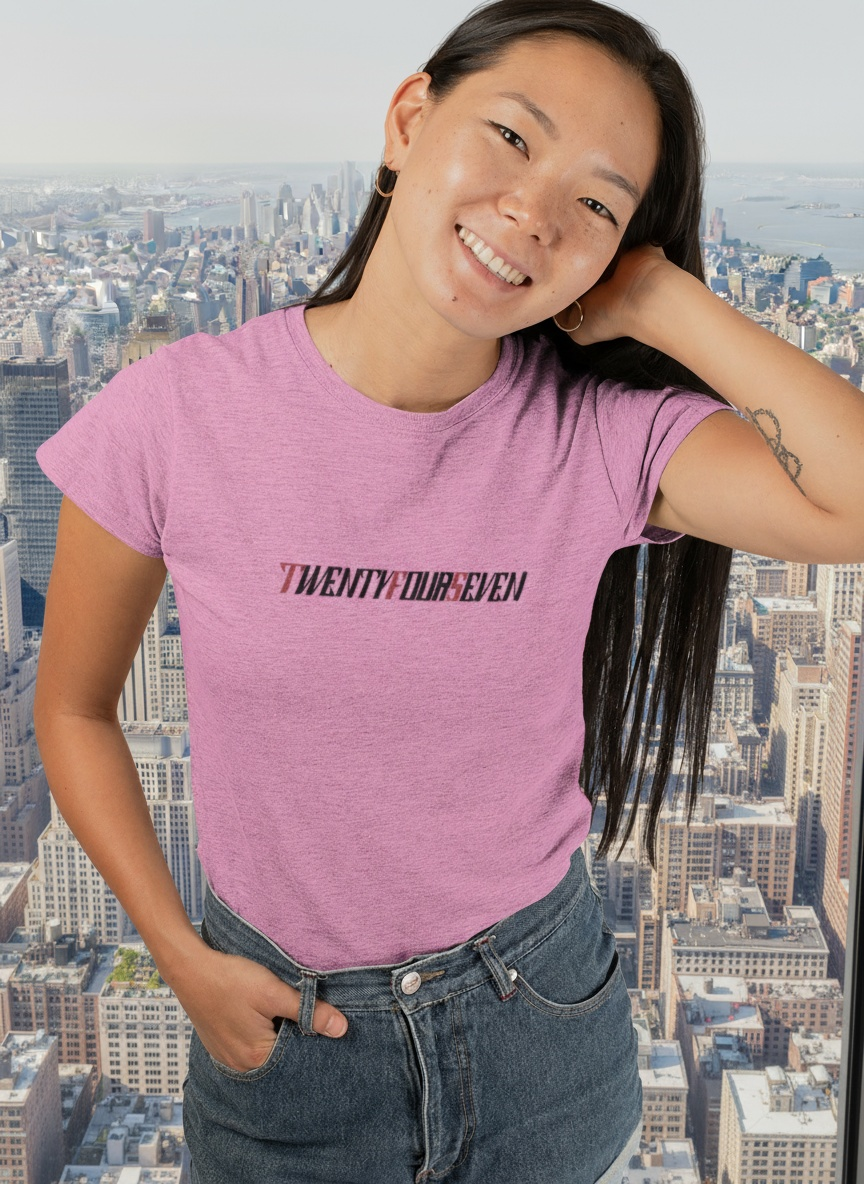 A female model wearing a vibrant azalea pink premium graphic t-shirt perfect for outdoor summer festivals.