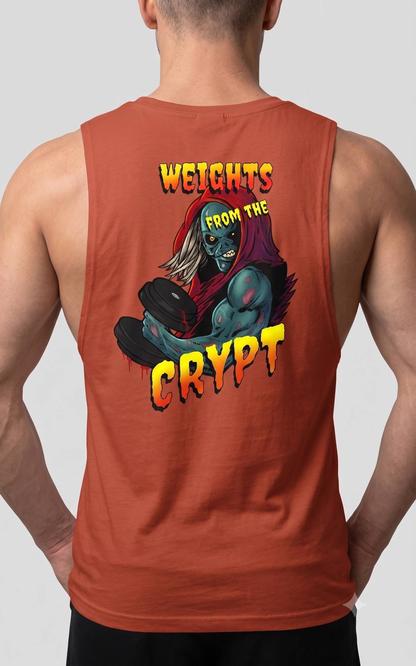 Muscular male model seen from the back wearing the autumn burnt orange bodybuilding muscle tank, highlighting the bold retro horror graphic and raw armholes.