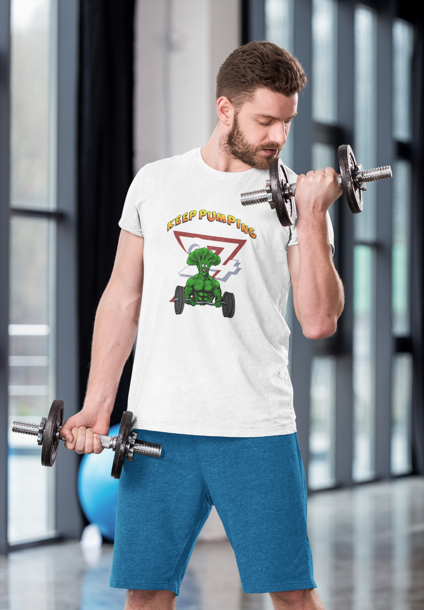 Muscular male model wearing the white funny broccoli weightlifting shirt, focused on performing heavy standing bicep curls with a barbell in a gym setting.