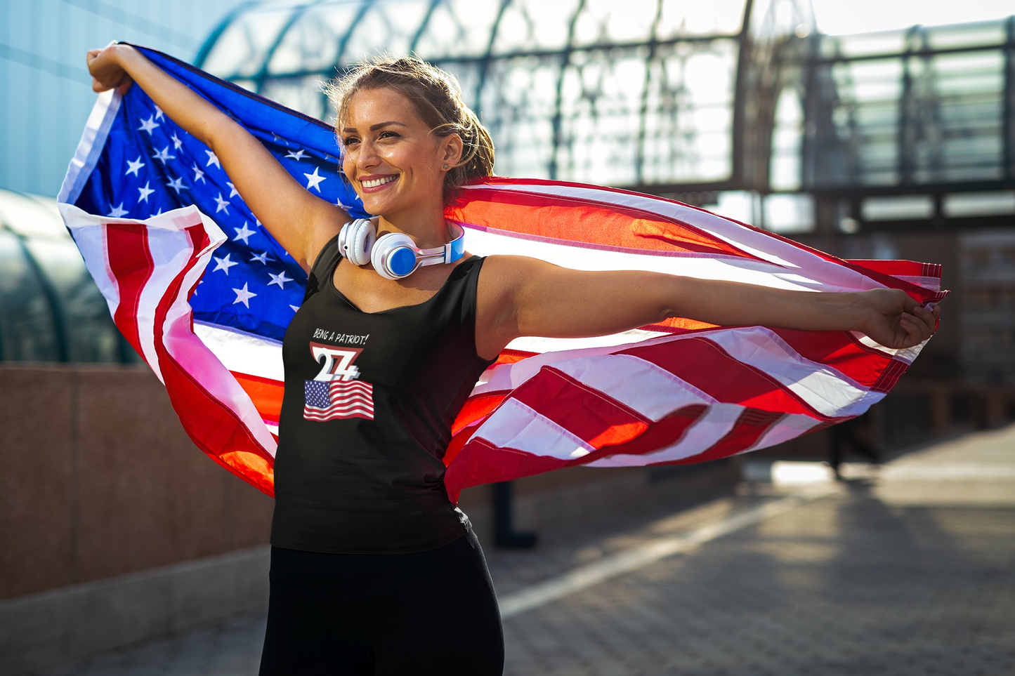 Woman modeling a black patriotic tank top with a comic artist drawn American flag.
