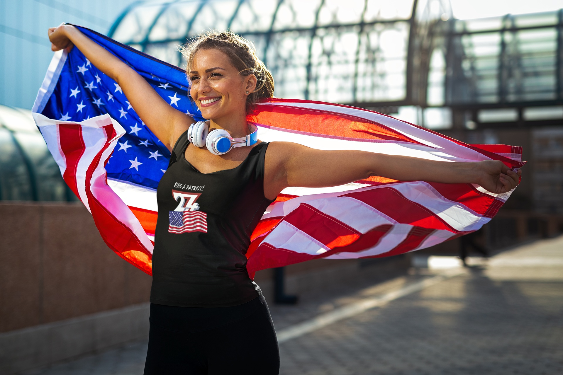 Woman modeling a black patriotic tank top with a comic artist drawn American flag.