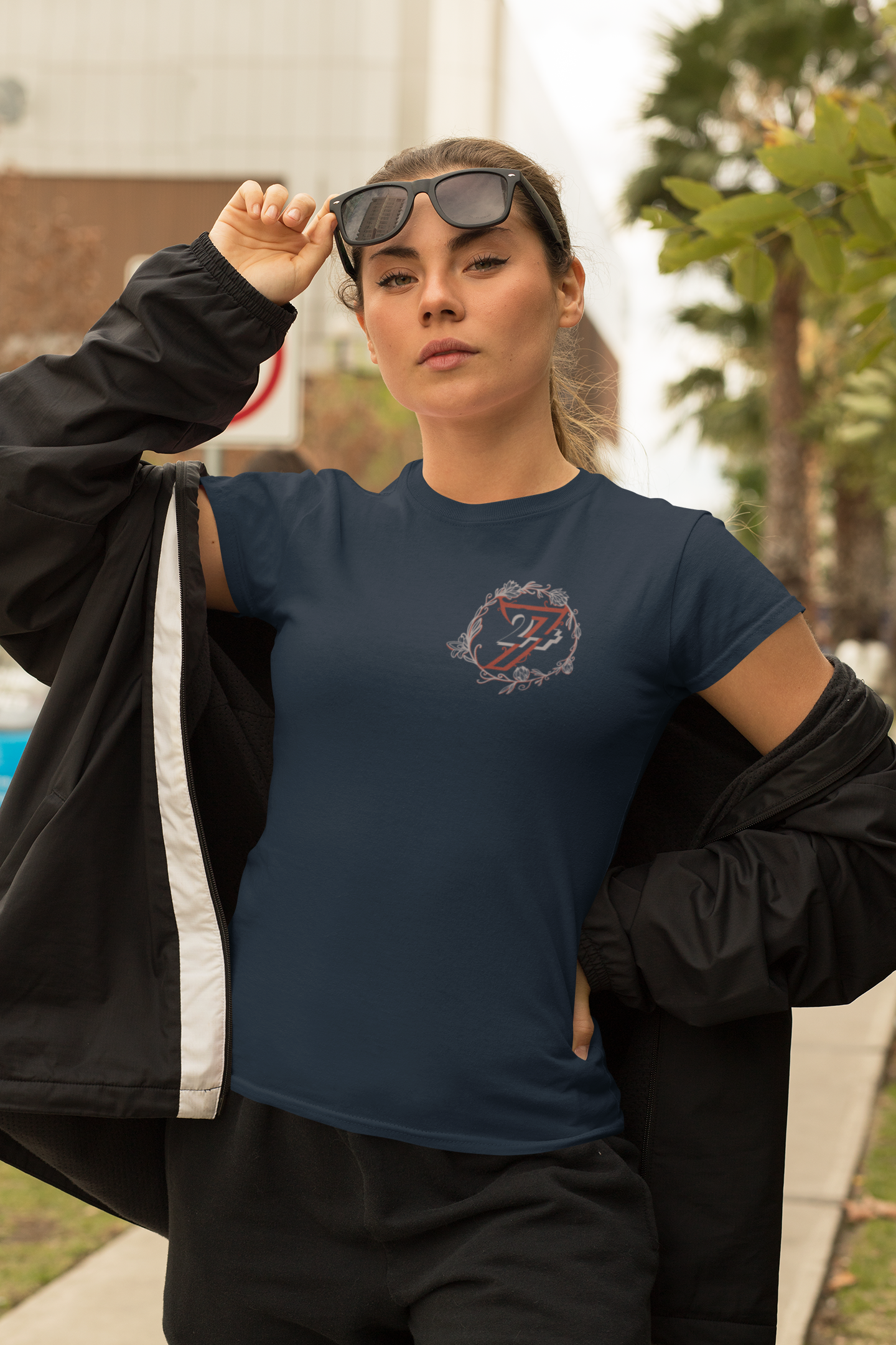 Woman in a dark navy chic botanical tee from an independent UK boutique.