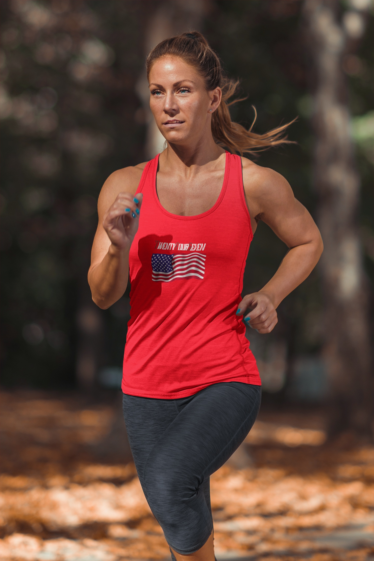 Woman modeling a bright red stylish American flag graphic tank.