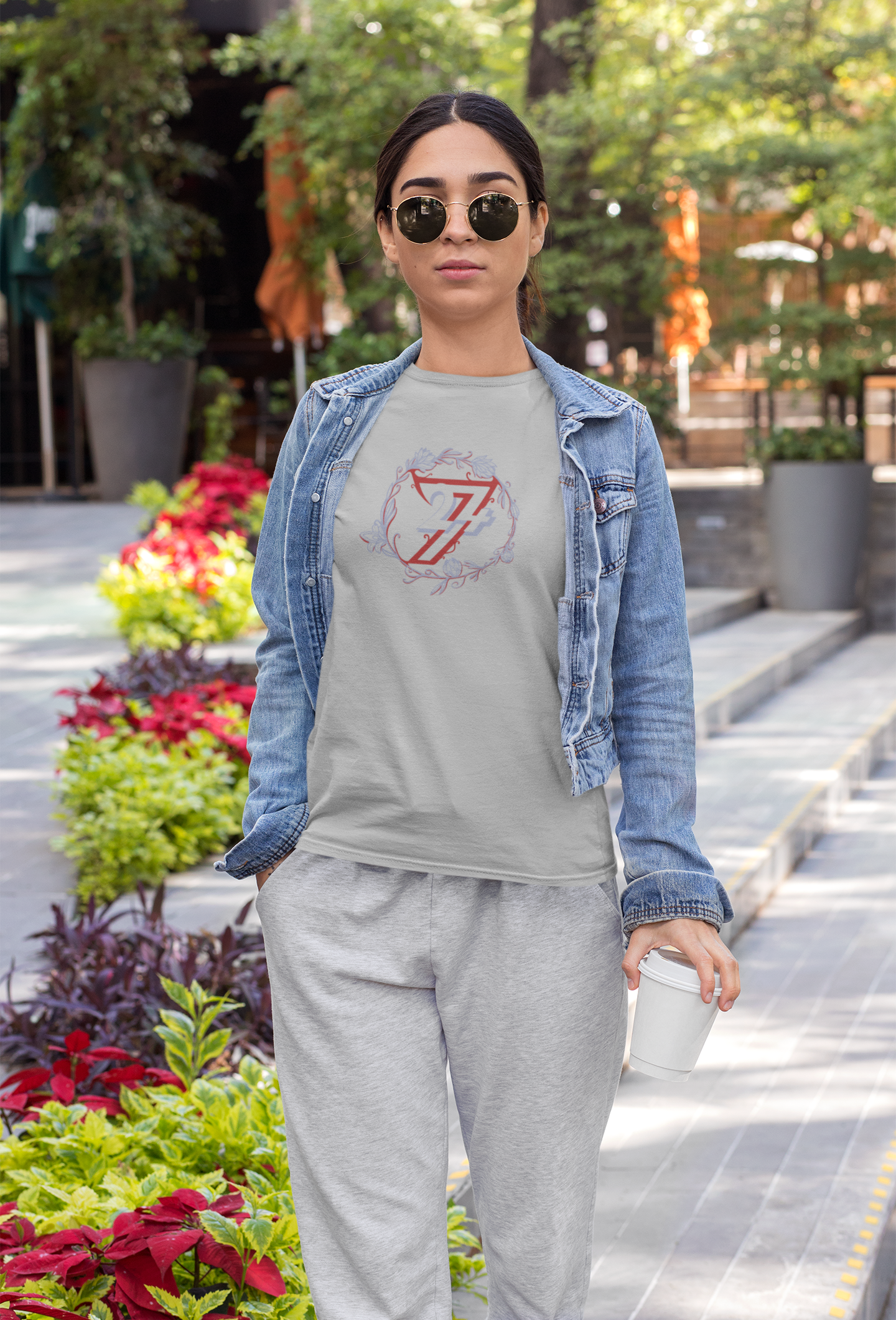Woman wearing a sport gray elegant flower halo top from an indie boutique.
