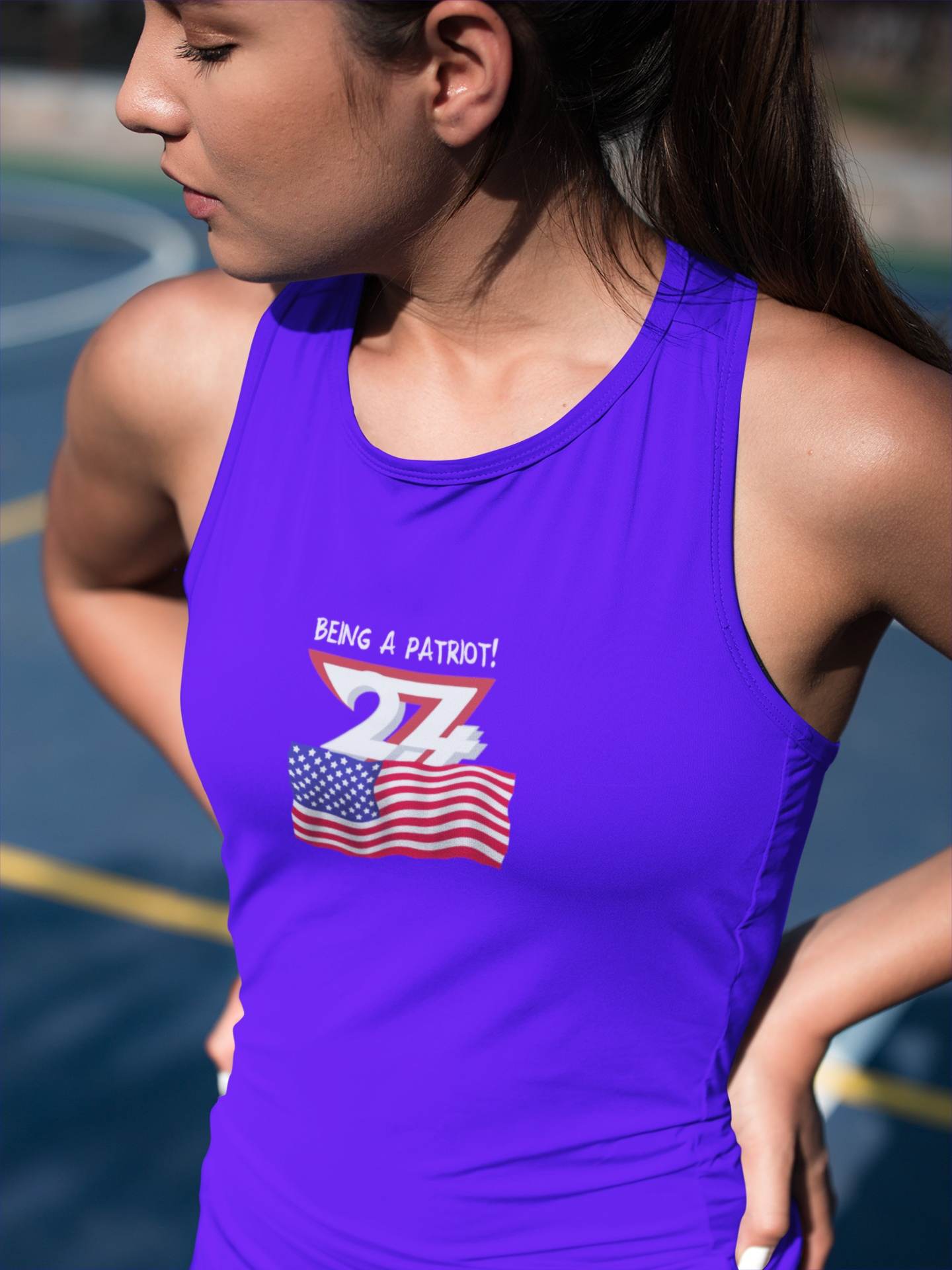 Woman in a true royal blue summer BBQ top featuring a hand-drawn Being a Patriot graphic.
