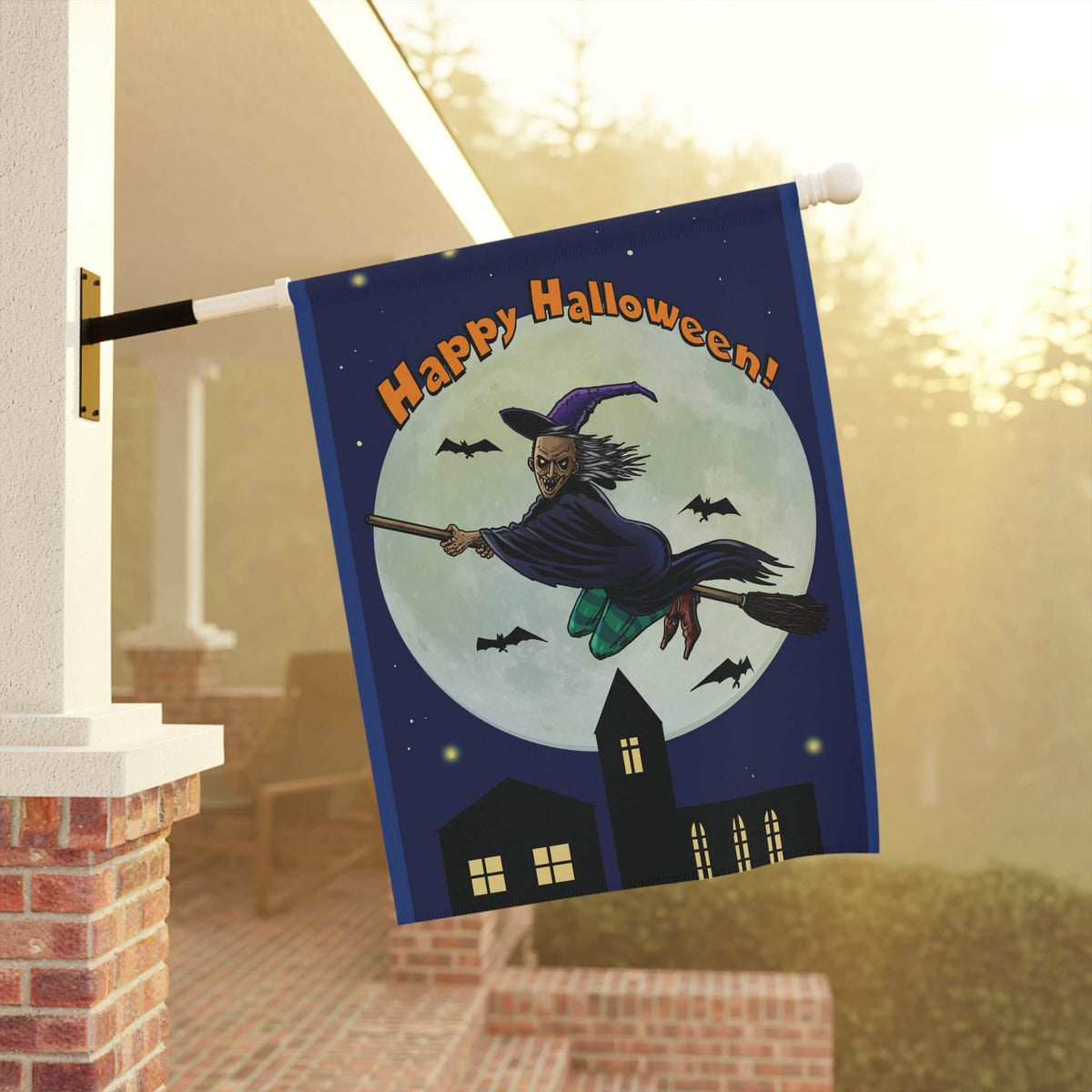 Spooky witch Halloween garden banner hanging from a white house porch column, catching the soft autumn sunlight while welcoming trick-or-treaters.