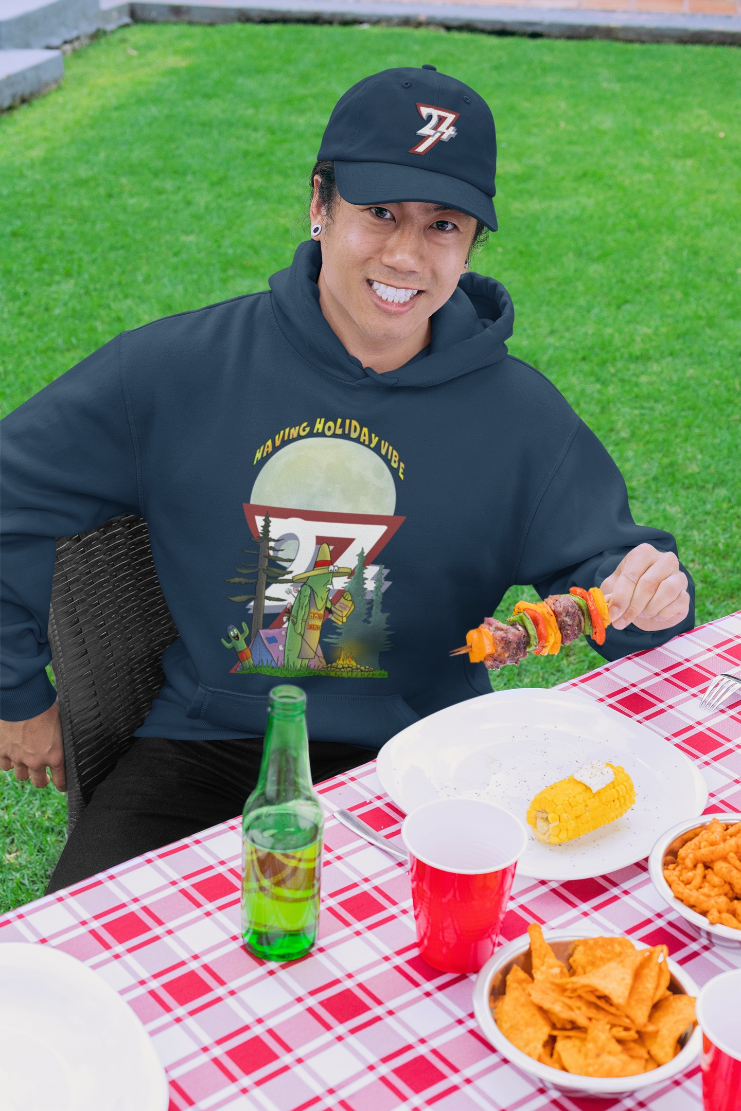 Man wearing the navy blue tri-color logo baseball cap