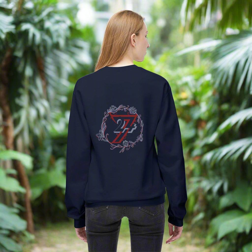 Back view of a woman modeling a dark navy blue pullover with a big flower logo on the back.