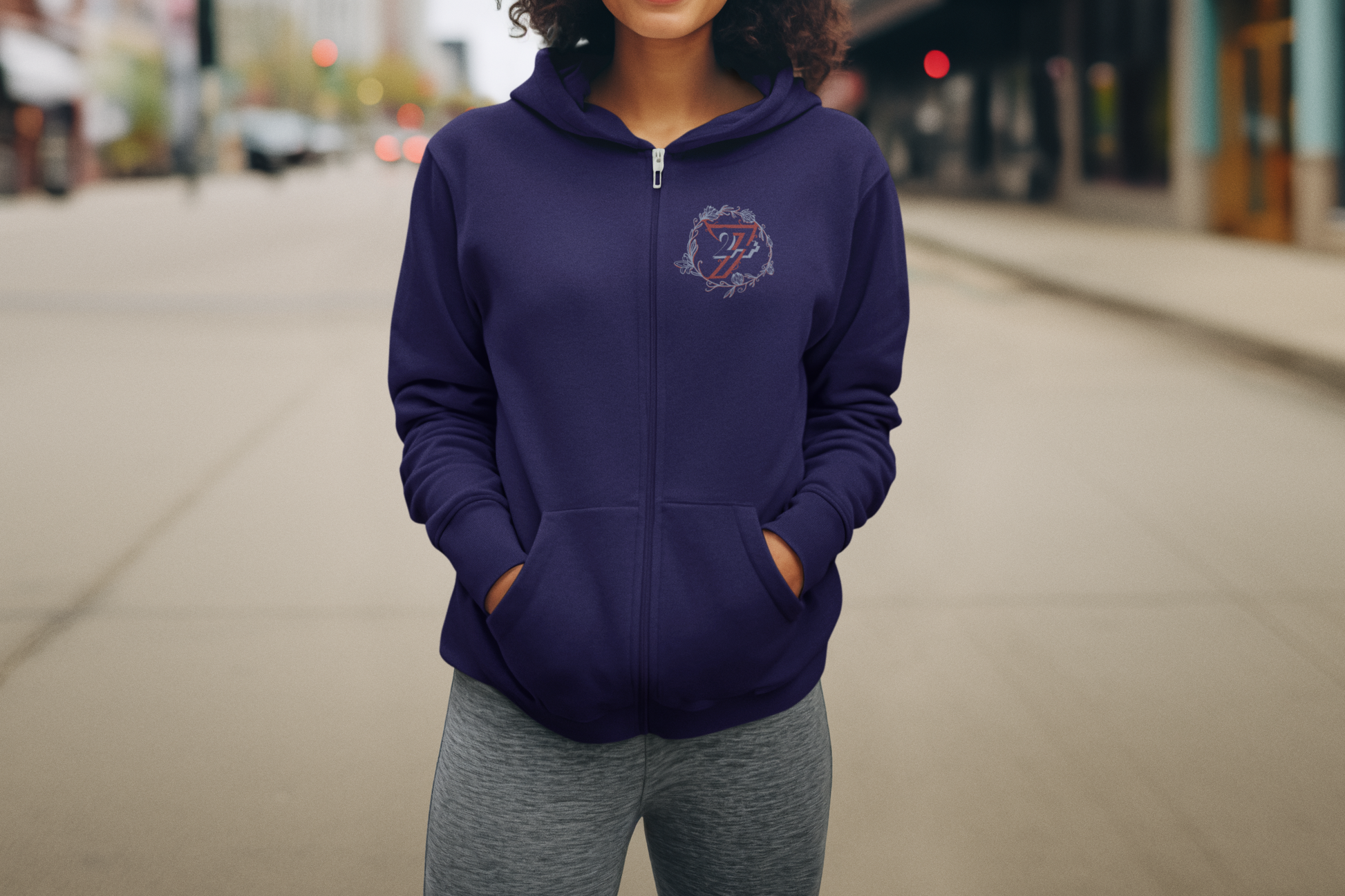 Front view of the Navy Women's Flower Zip Hoodie worn by a female model