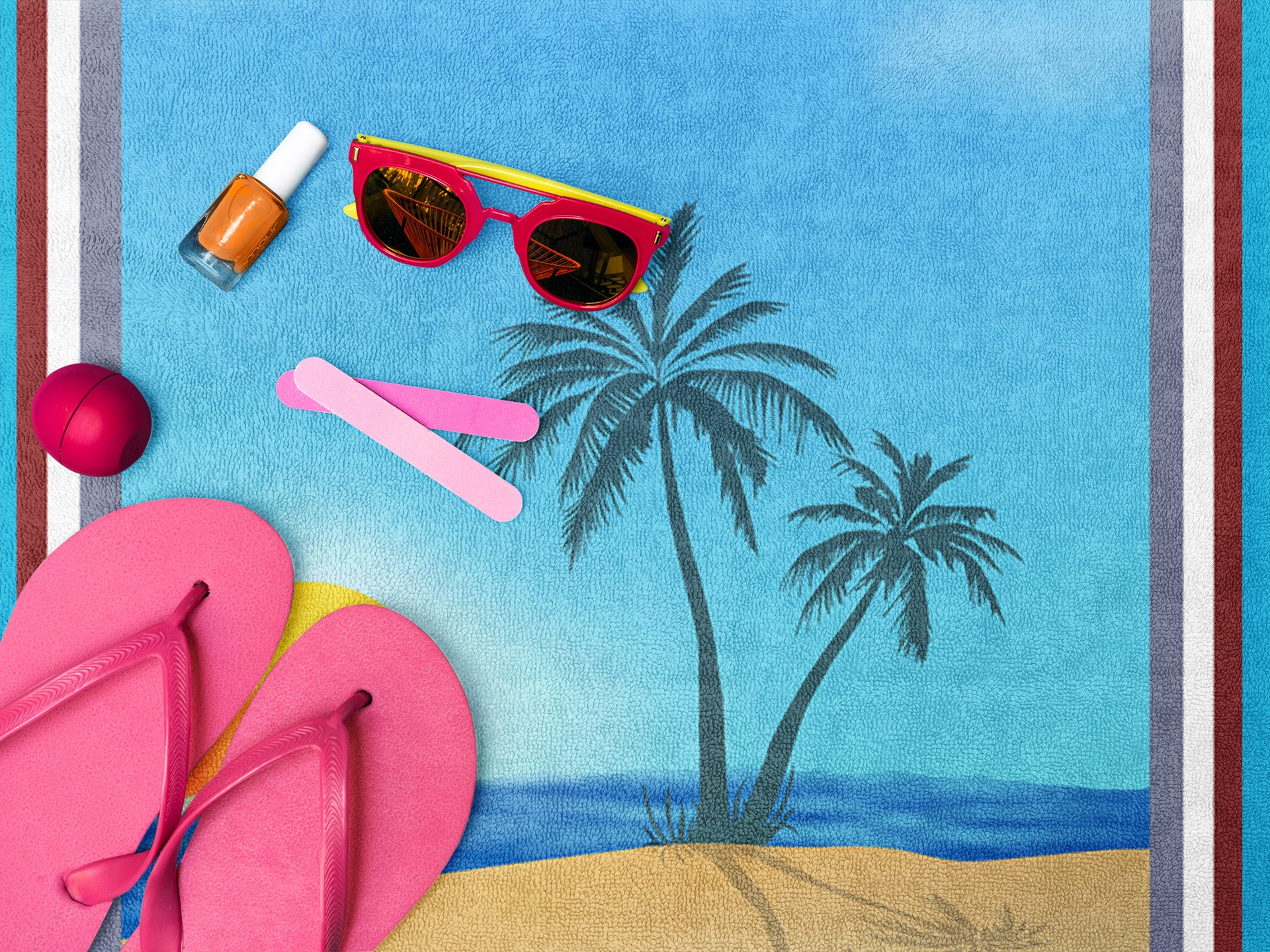 Close-up of a summer beach towel design featuring a green cactus character in the bottom corner.