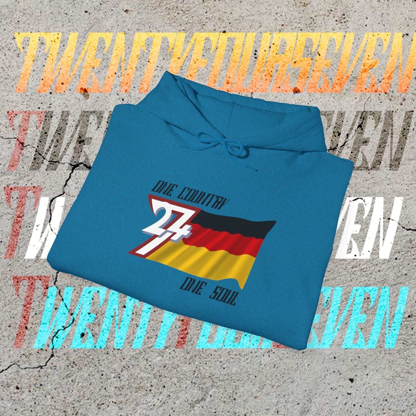A professional display of a folded Ocean Blue Deutschland hoodie, showcasing the thickness of the 8oz fleece.