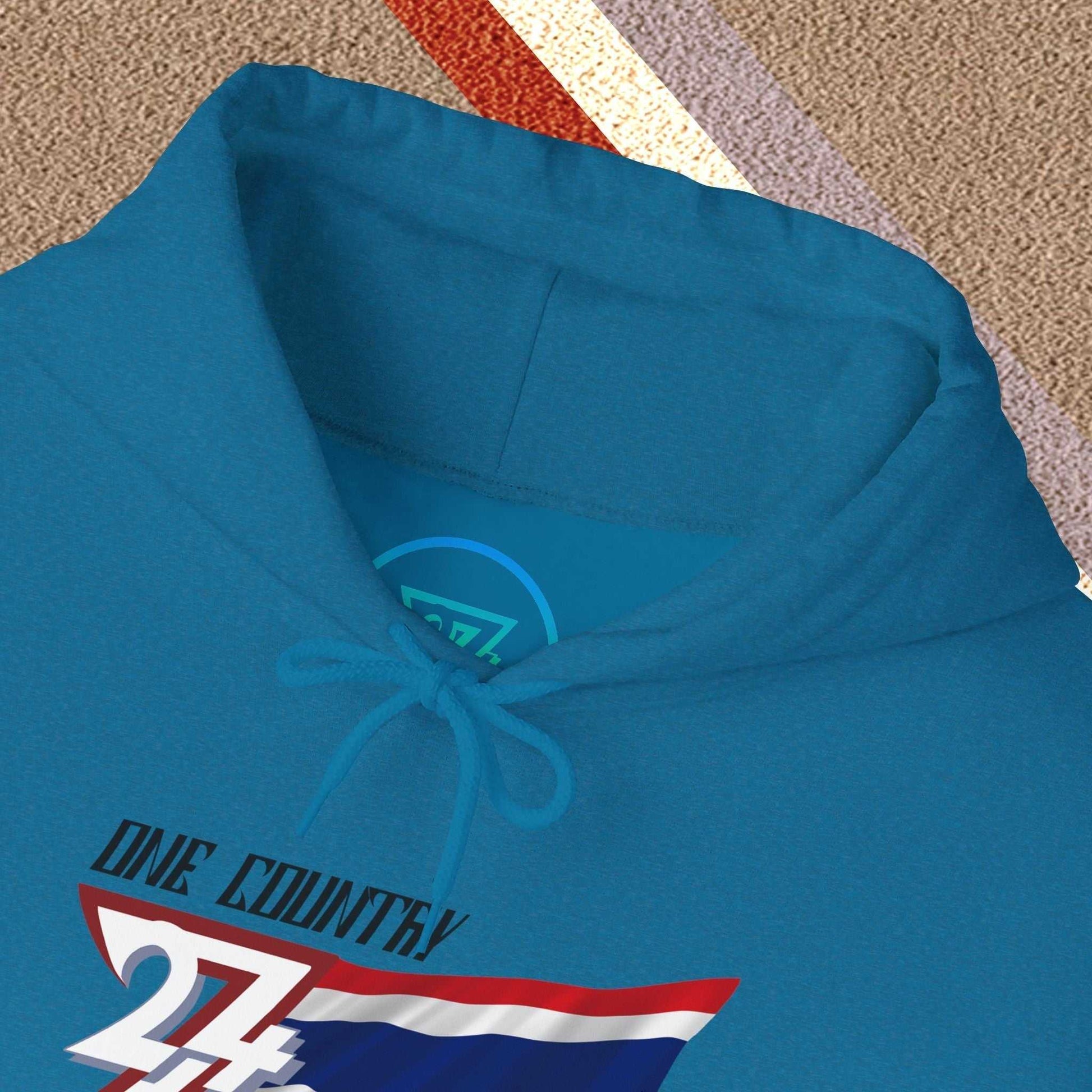 Macro close-up of the inner neck area showing the tear-away label and authentic 24/7 Unique Designs trademark logo.