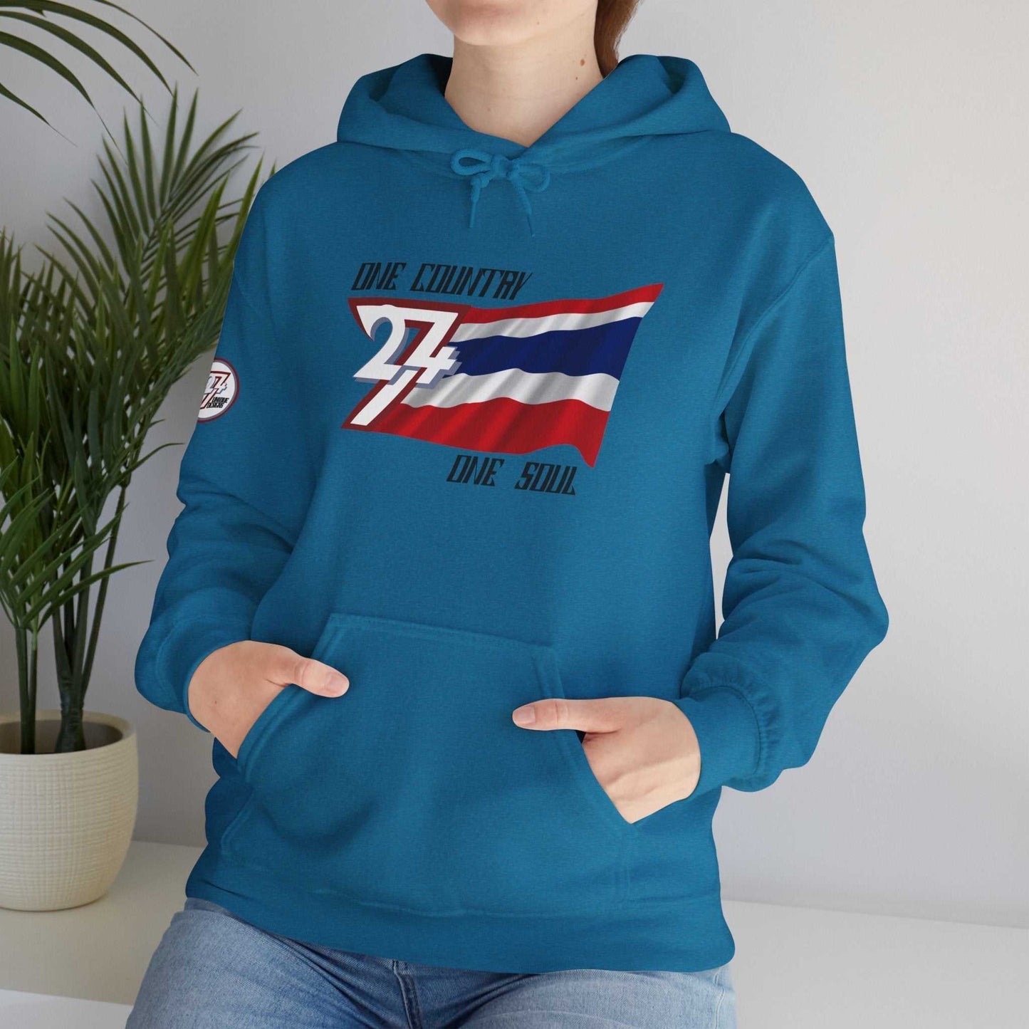 Model wearing the Thailand "Spirit" edition hoodie in Charcoal, showing a modern, refined streetwear look.