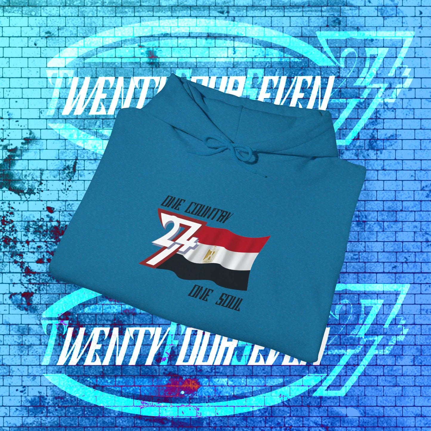 A professional display of the Egypt flag hoodie in Ocean Blue, folded to showcase the refined hand-drawn graphic and high-quality fleece finish.